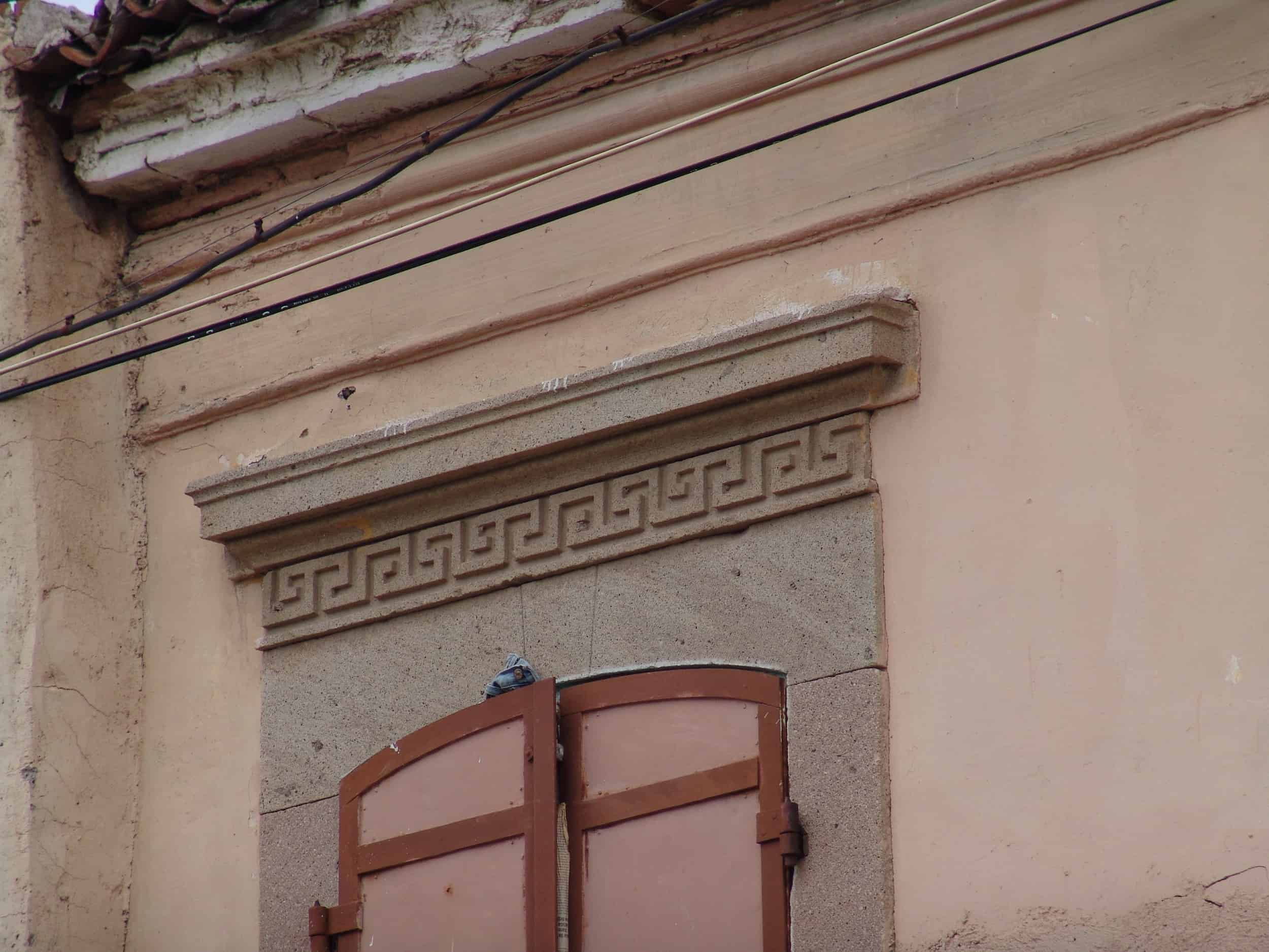 Greek key above a window