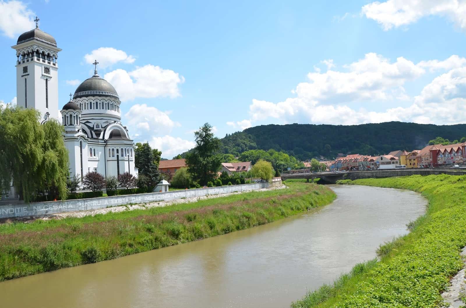 Holy Trinity Church and Târnava Mare River in Sighişoara, Romania