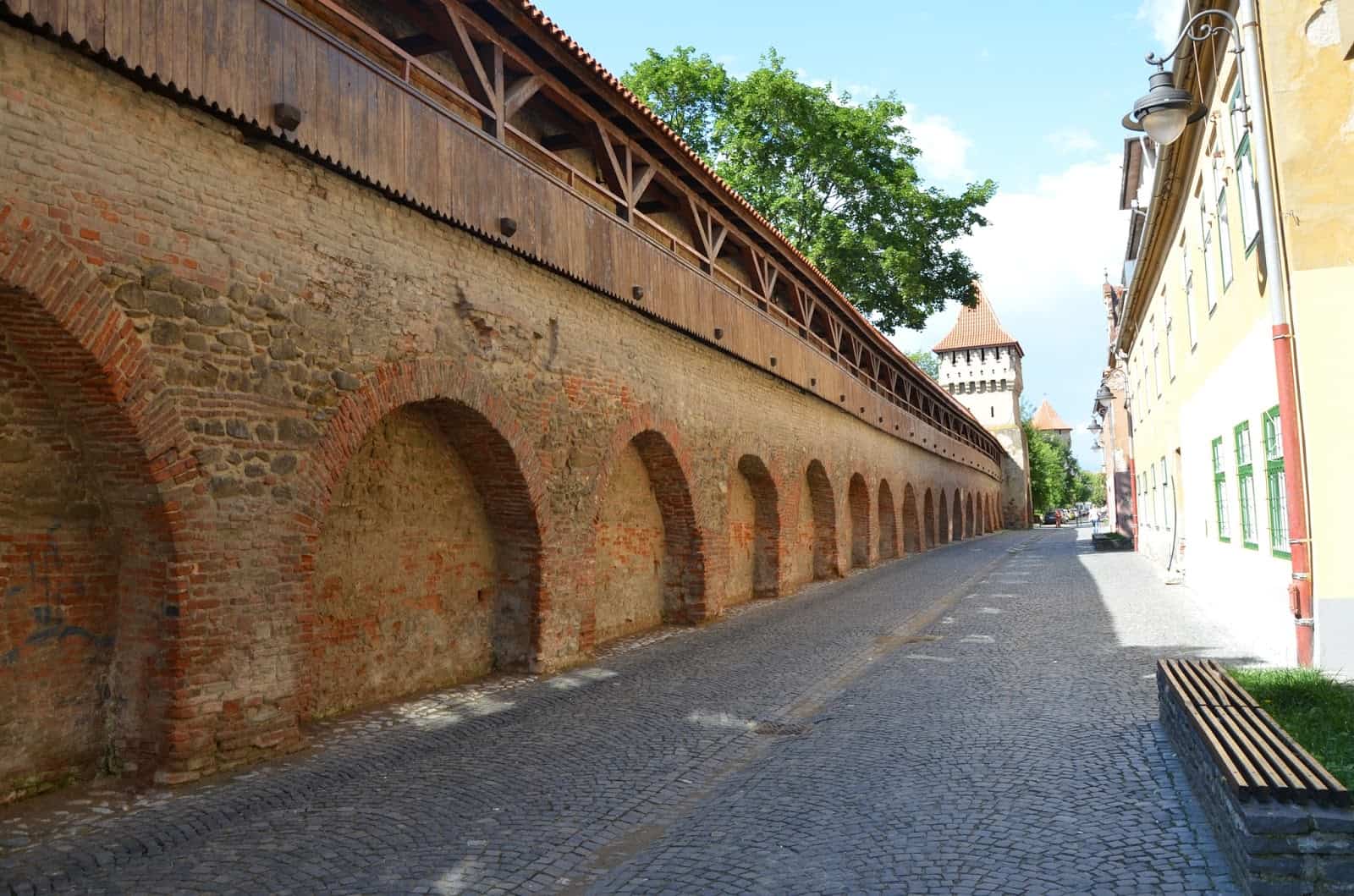 City walls along the street in Sibiu, Romania