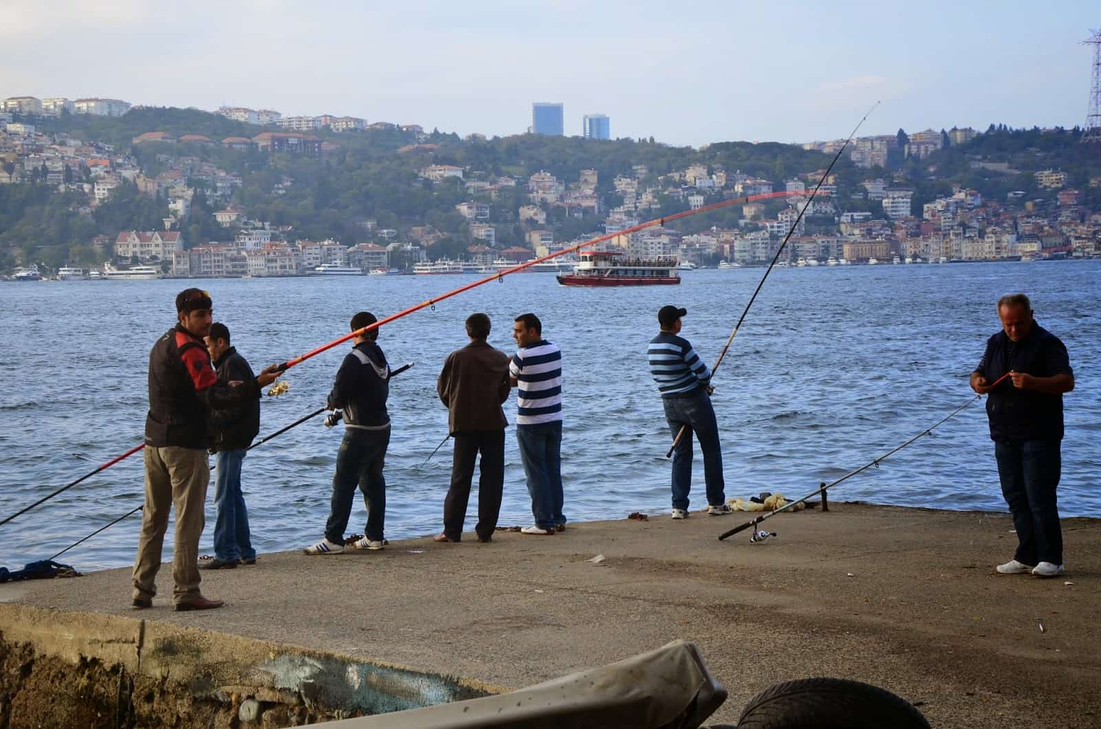Fishermen in front of Kuleli Askeri Lisesi in Çengelköy, Istanbul, Turkey