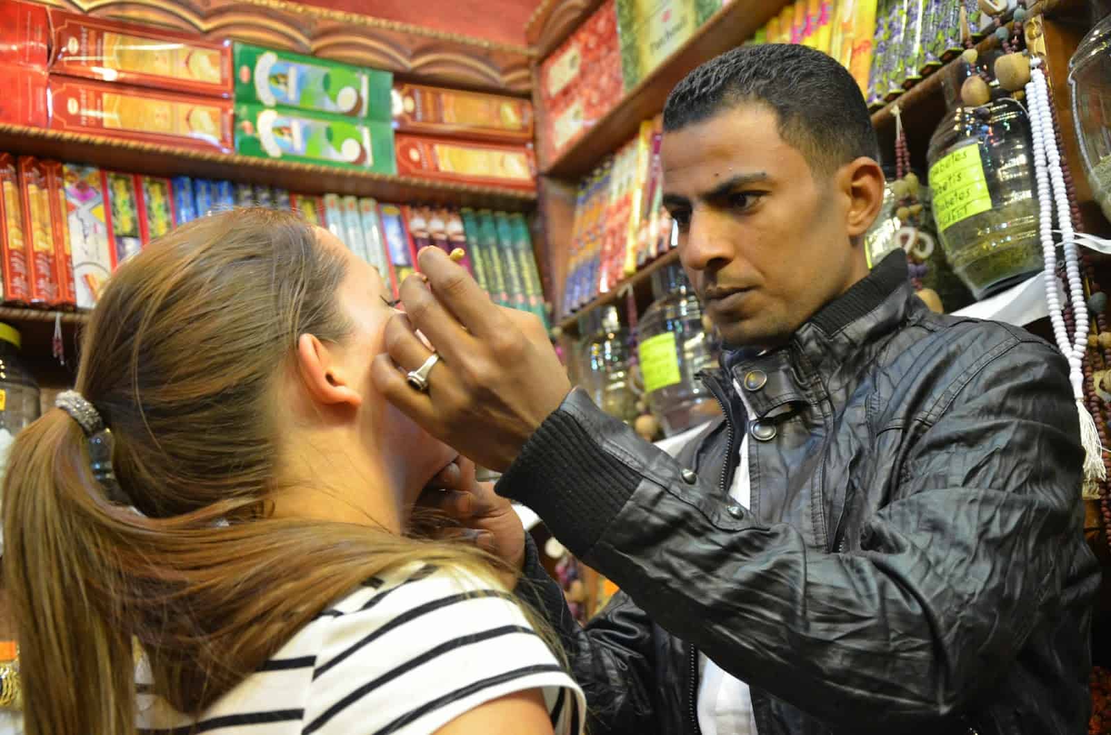 Tyra getting a makeup demonstration at the souk in Sharm el-Sheikh, Egypt