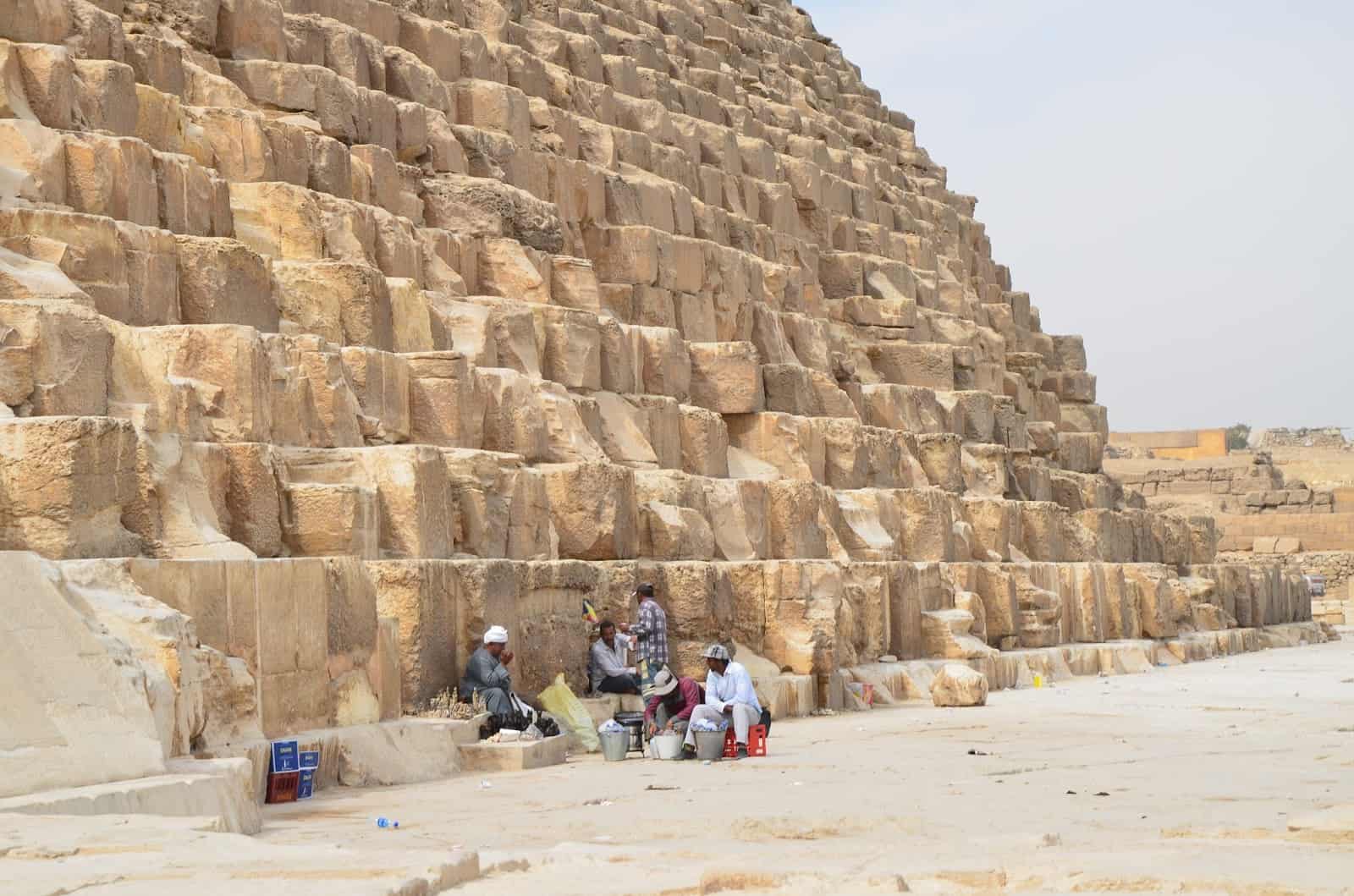 Vendors resting at the Pyramid of Khufu at the Pyramids of Giza in Egypt