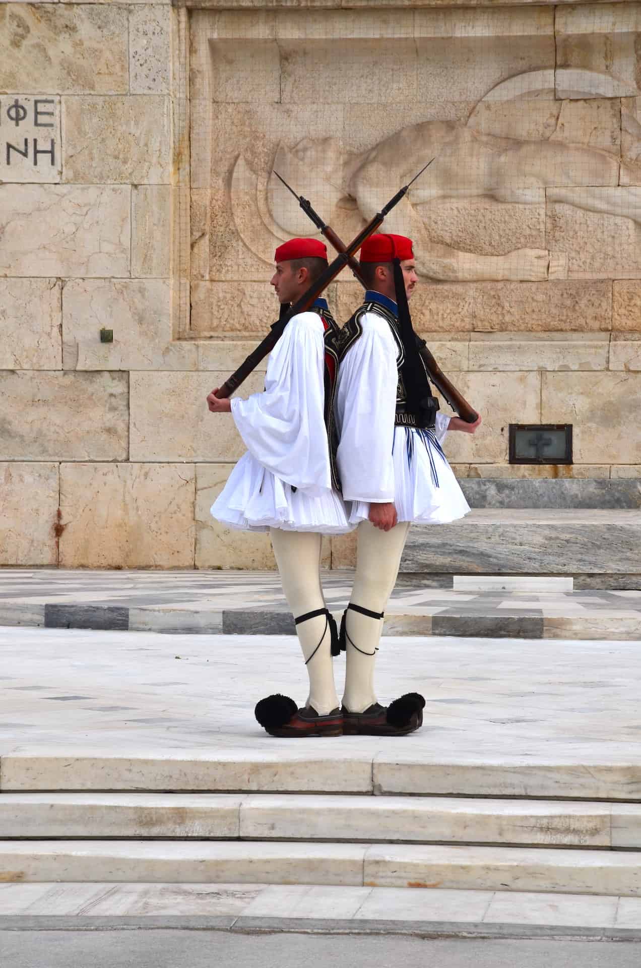 Evzones in formal Sunday uniforms at the Tomb of the Unknown Soldier in Athens, Greece