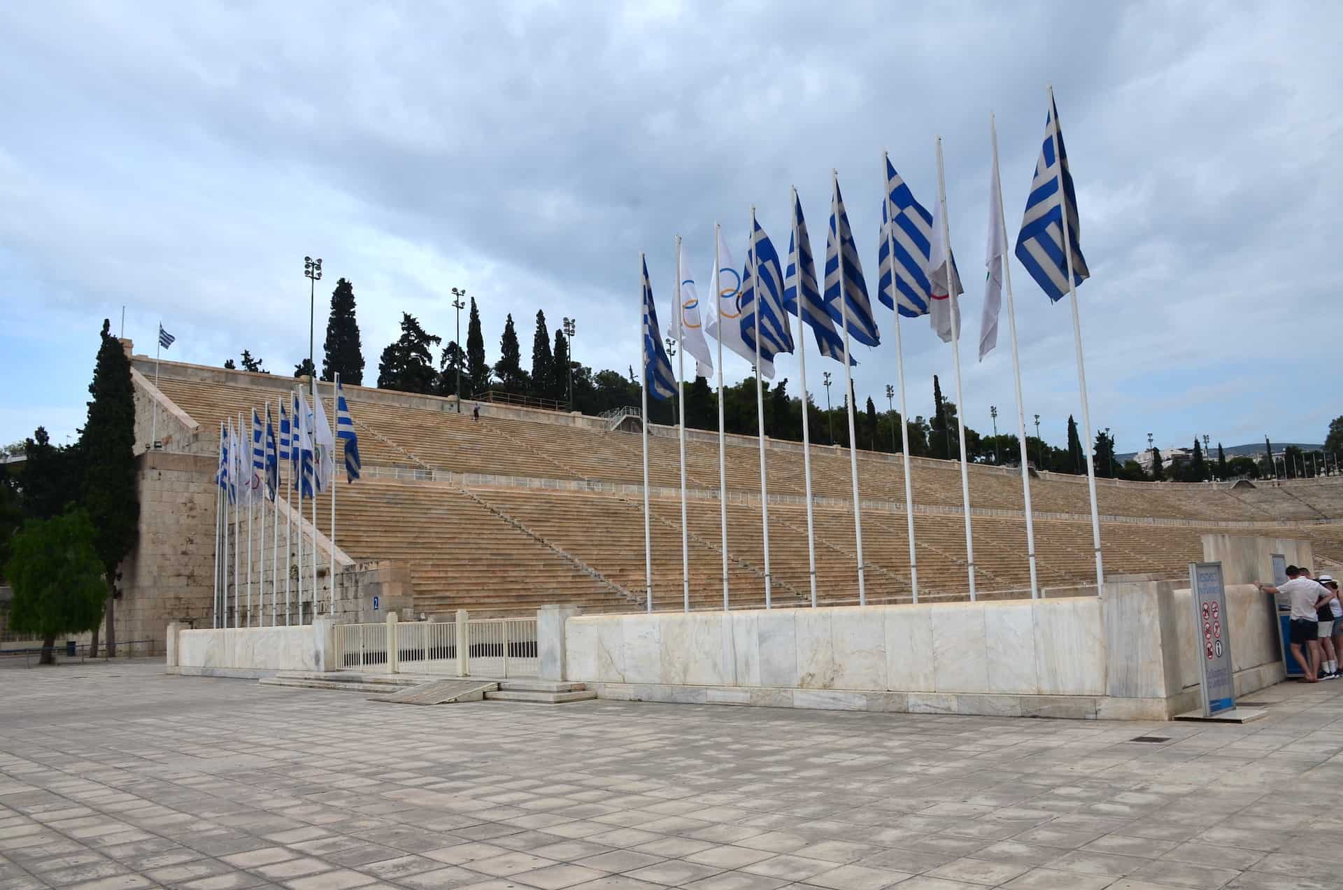 Greek and Olympic flags at Panathenaic Stadium in Athens, Greece