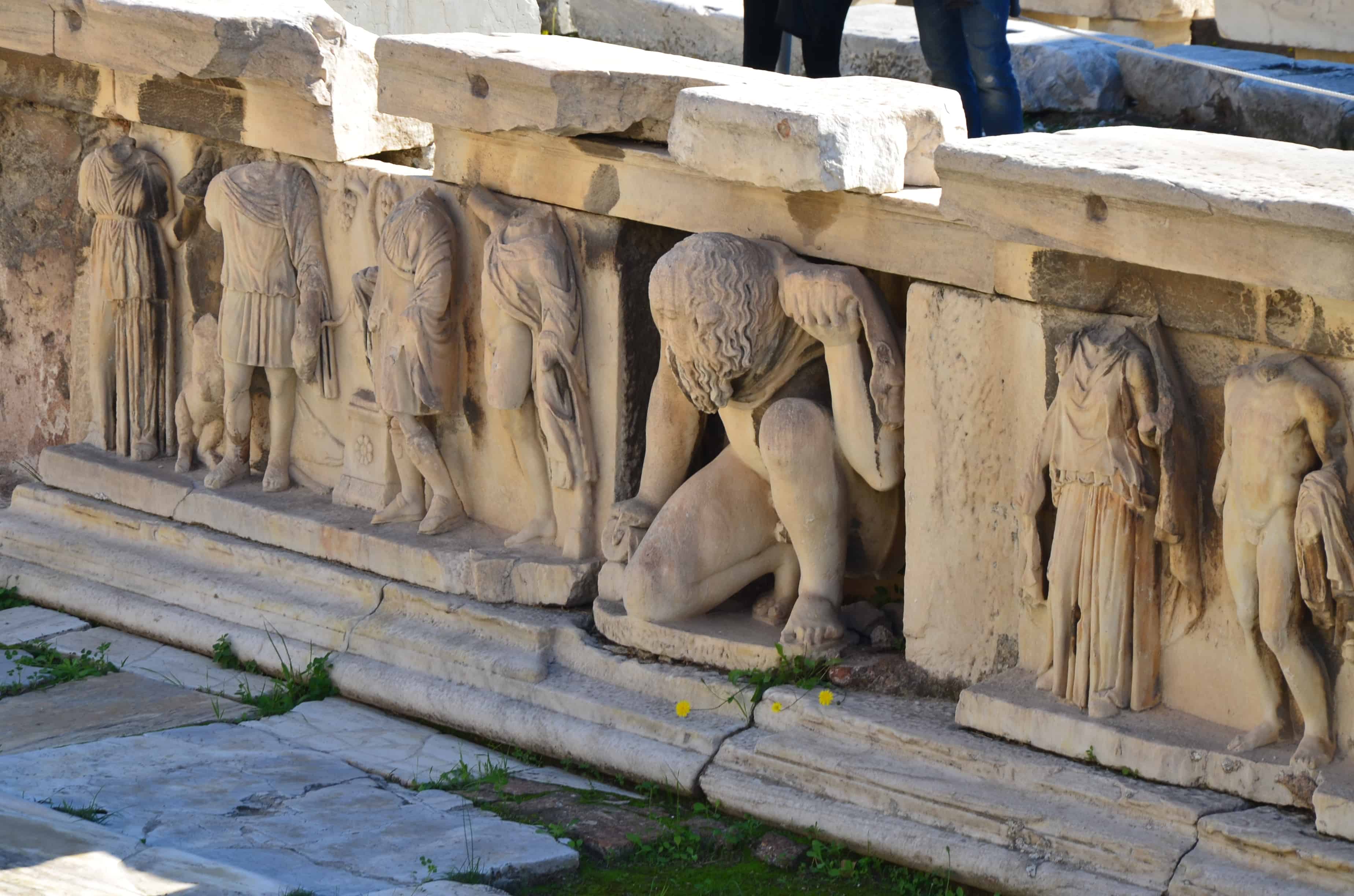Bema of Phaedros with a kneeling statue of a satyr at the Theatre of Dionysus in Athens, Greece