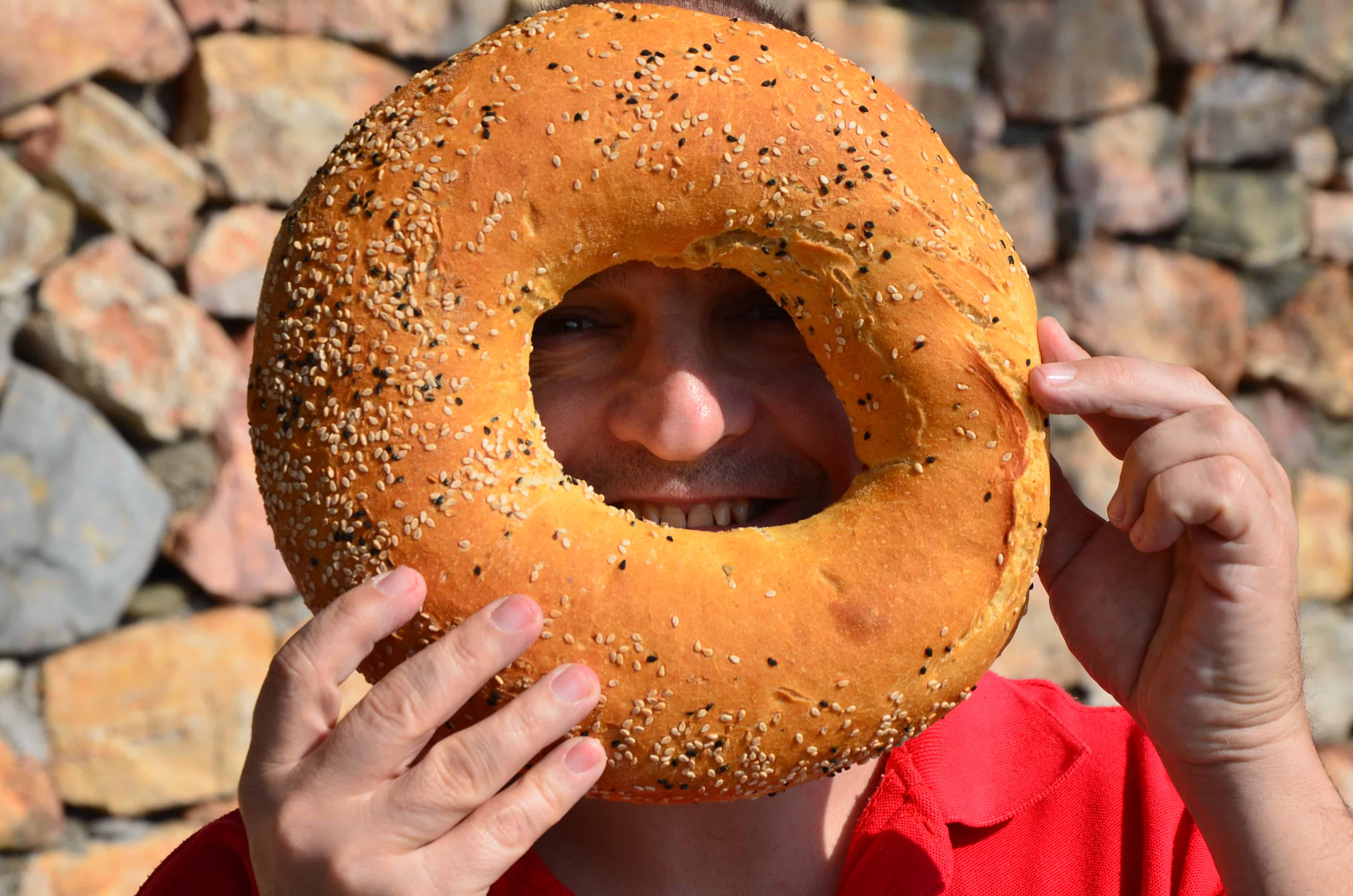 Martin having fun with the bread at Ovabükü, Datça, Turkey