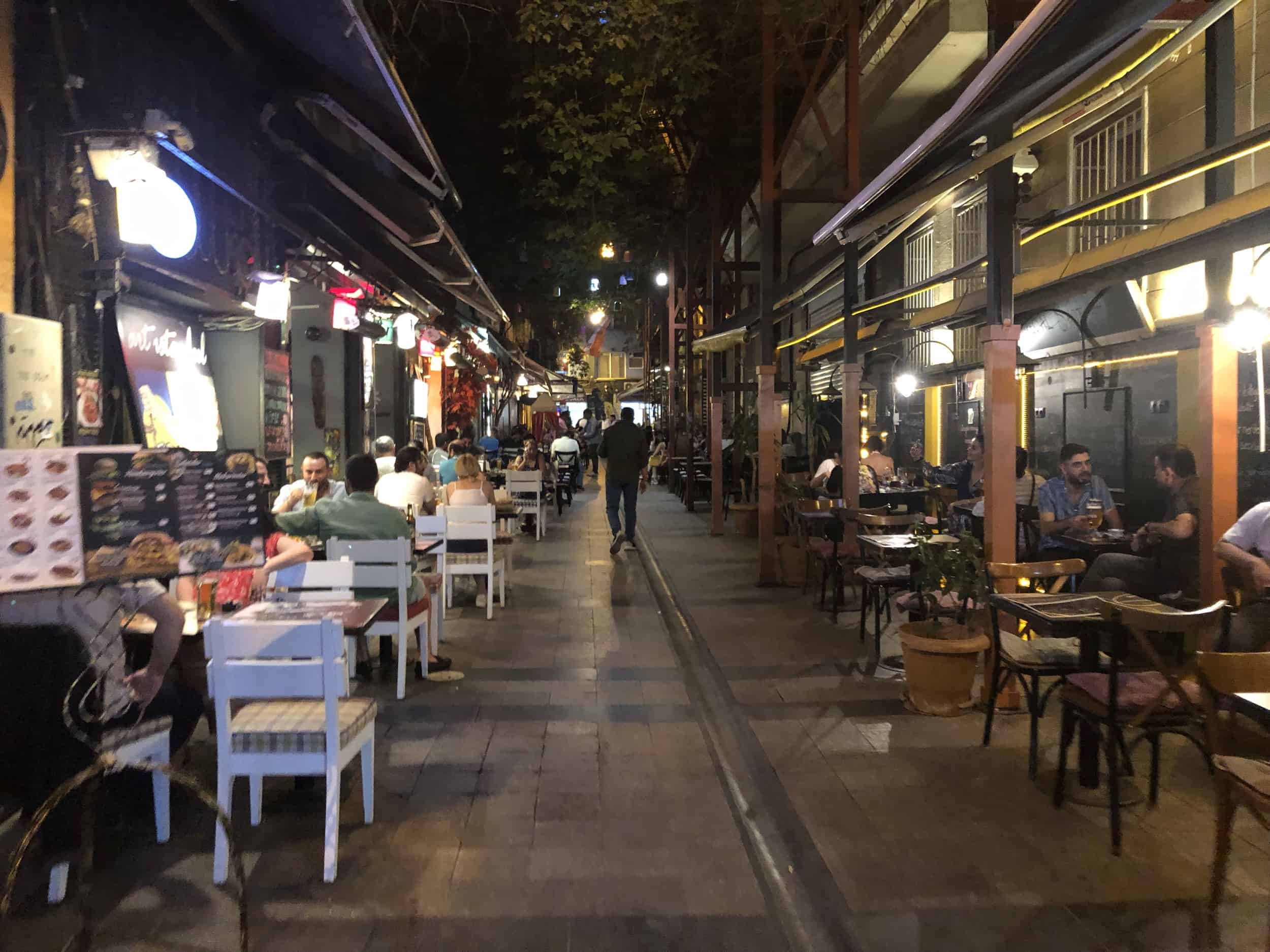 A back street off Istiklal Street lined with outdoor restaurants and cafés