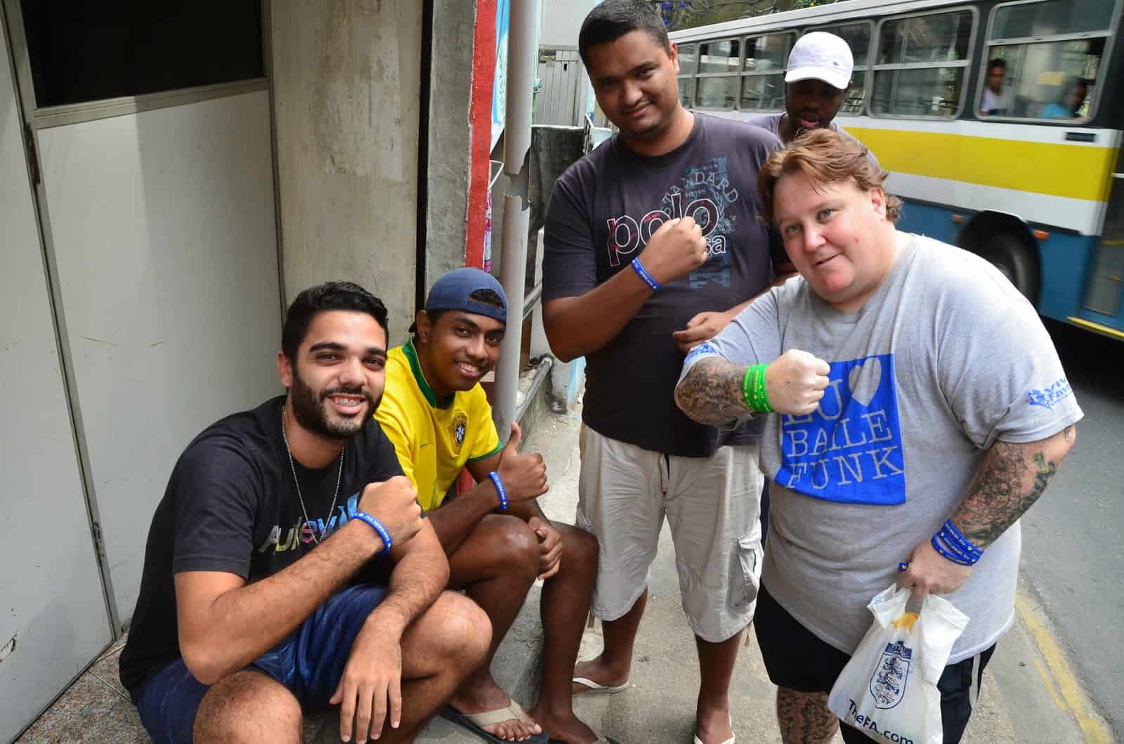 Zezinho passing out wristbands at Rocinha favela, Rio de Janeiro, Brazil