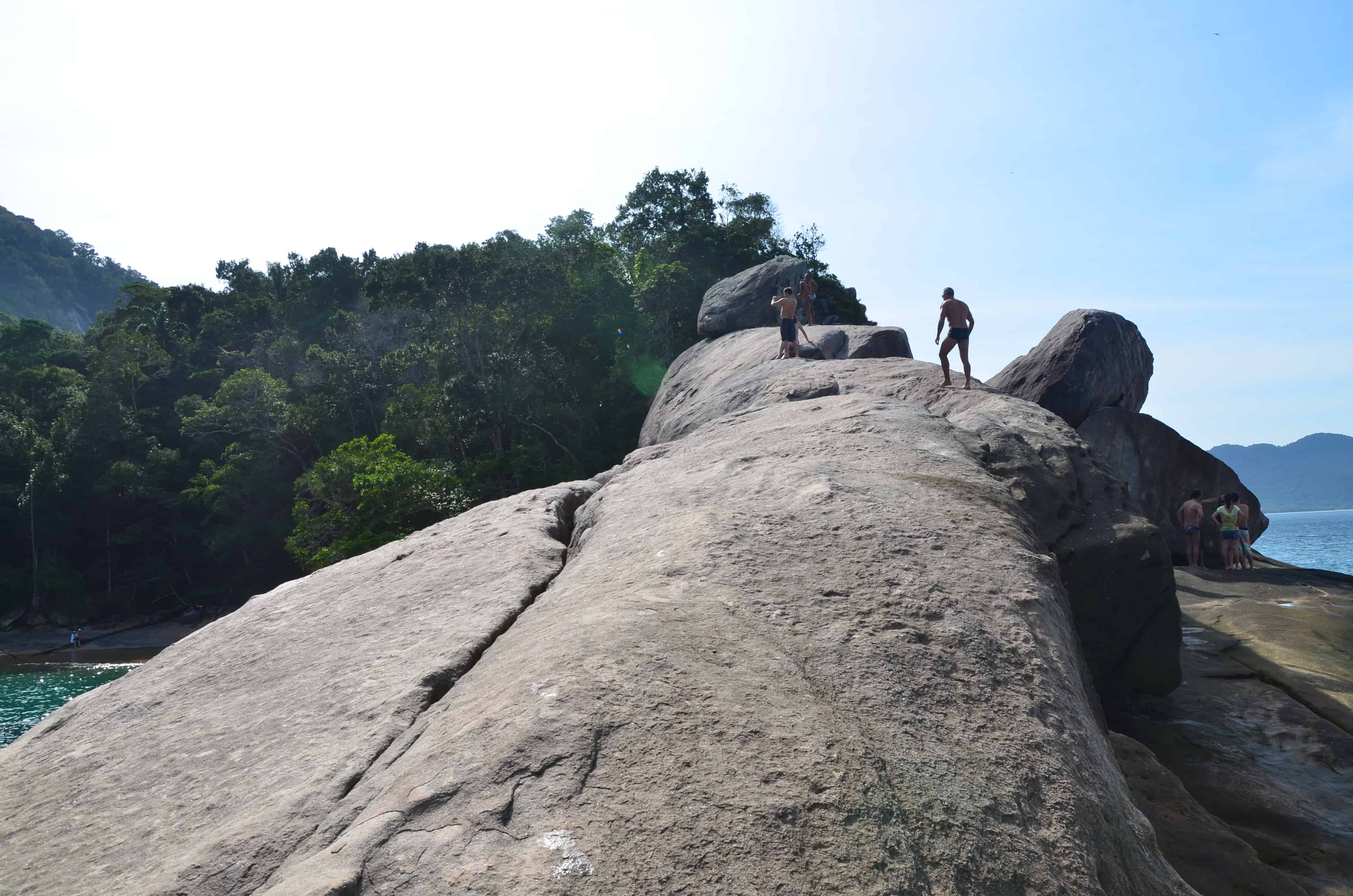 Climbing on the rocks at Caxadaço Beach