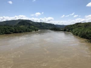 Looking east down the Cauca River from the Francisco Jaramillo Ochoa Bridge in La Virginia, Colombia