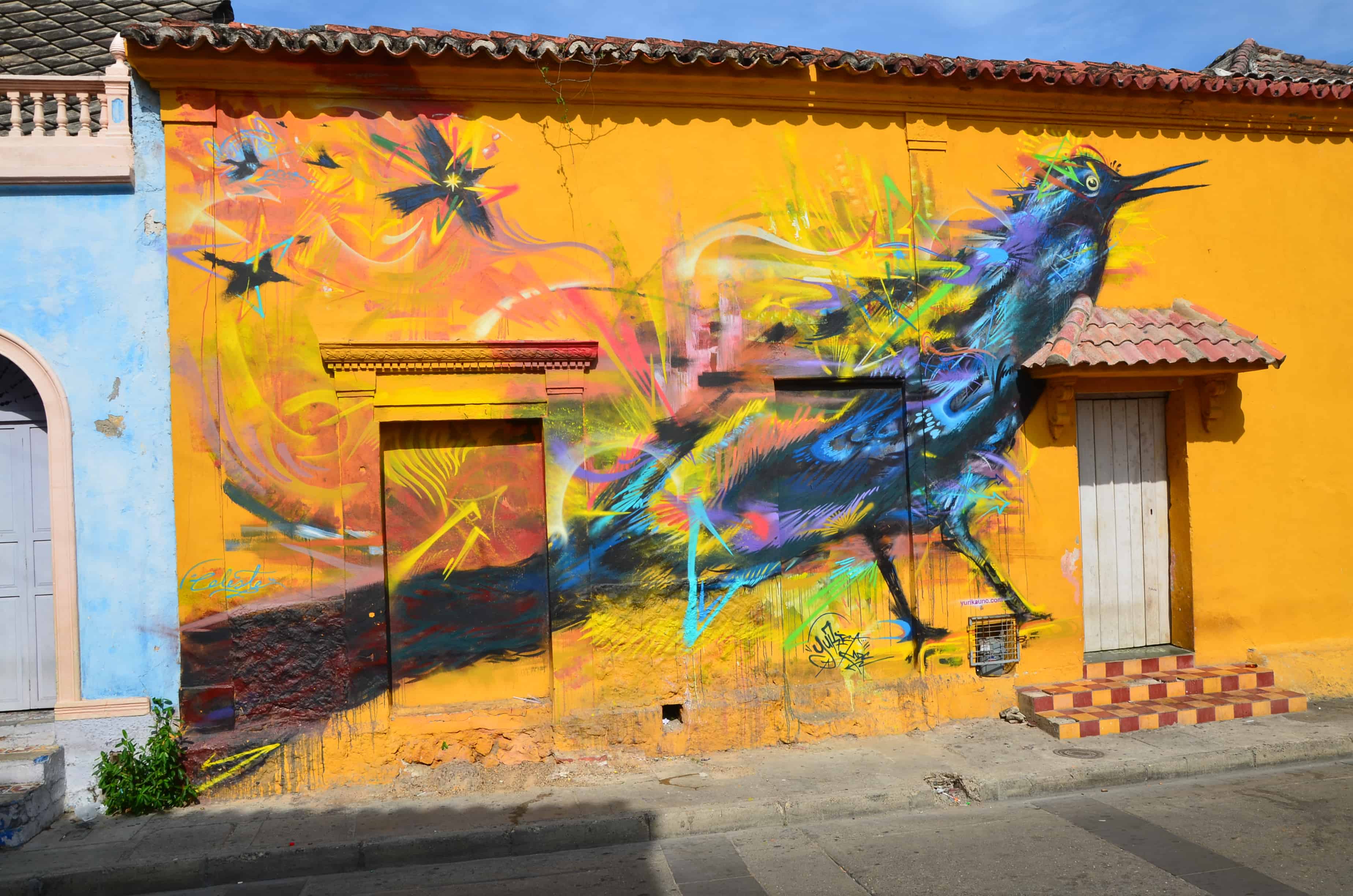 Mural of a colorful bird on Plaza de la Trinidad