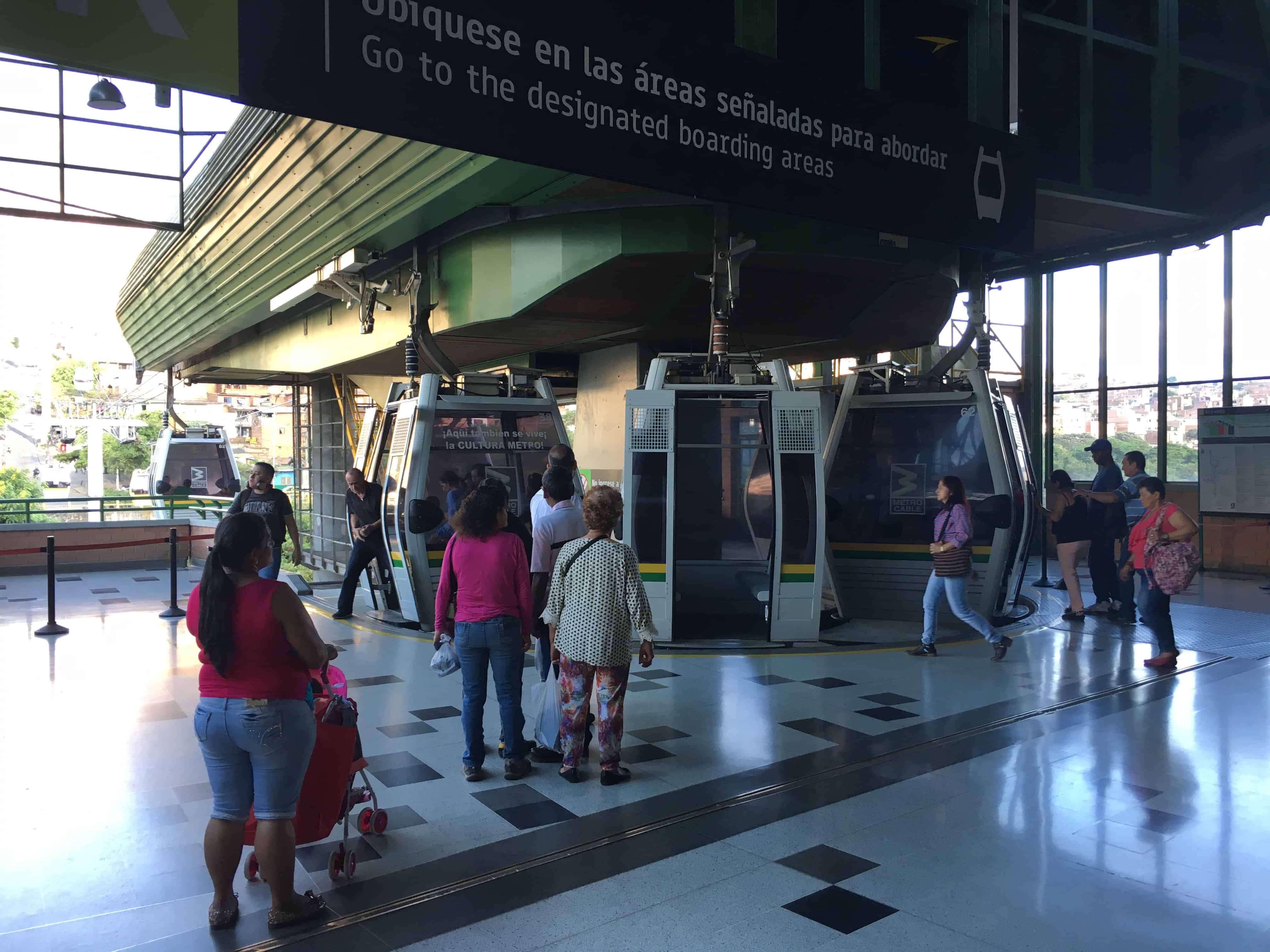 Boarding the cable car at Metrocable Line K in Medellín, Antioquia, Colombia
