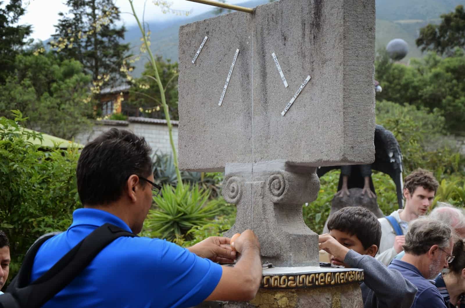 Balancing an egg at Intiñan Museum at Mitad del Mundo in Ecuador