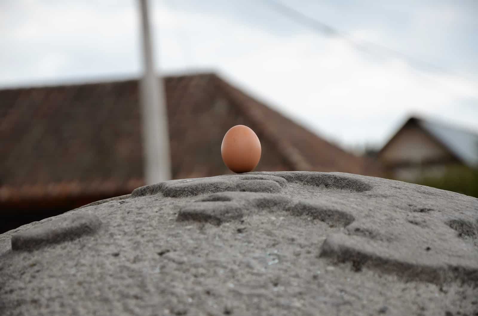Egg balanced on the stone globe near Cayambe, Ecuador