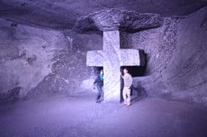 Tourists posing with a cross made of salt