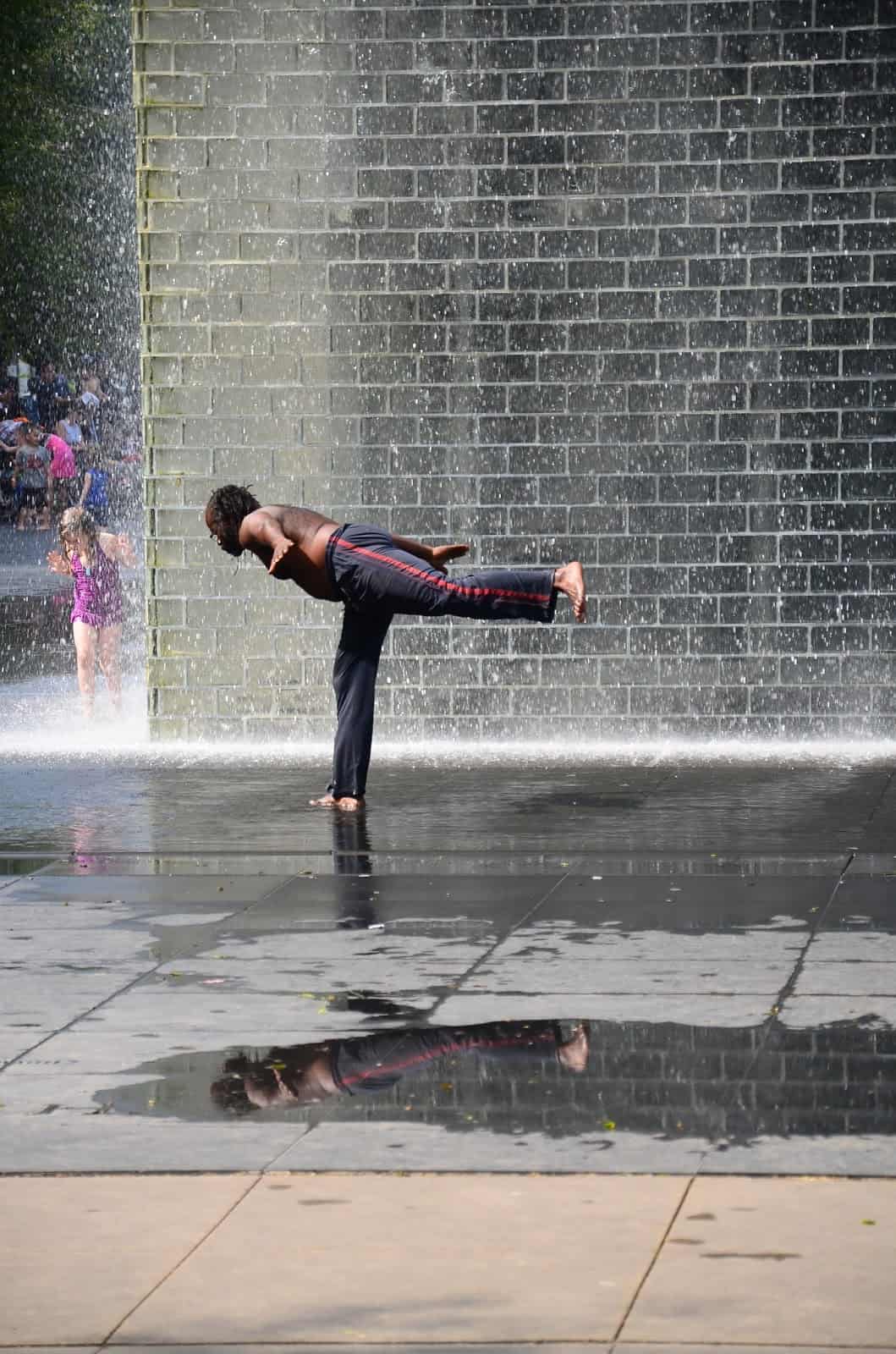A man enjoying the Crown Fountain at Millennium Park in Chicago