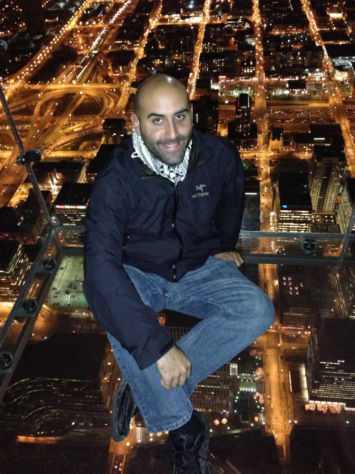 Me sitting on the Ledge at the Skydeck at Willis Tower (Sears Tower) in Chicago