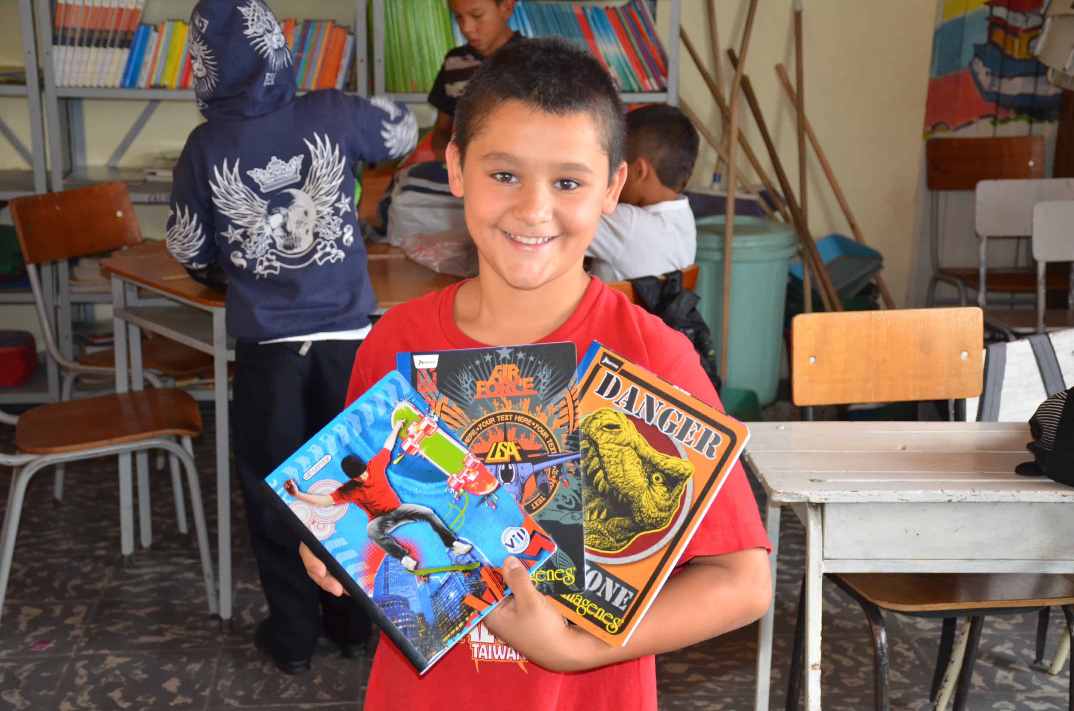A student with his new notebooks in Belén de Umbría, Risaralda, Colombia