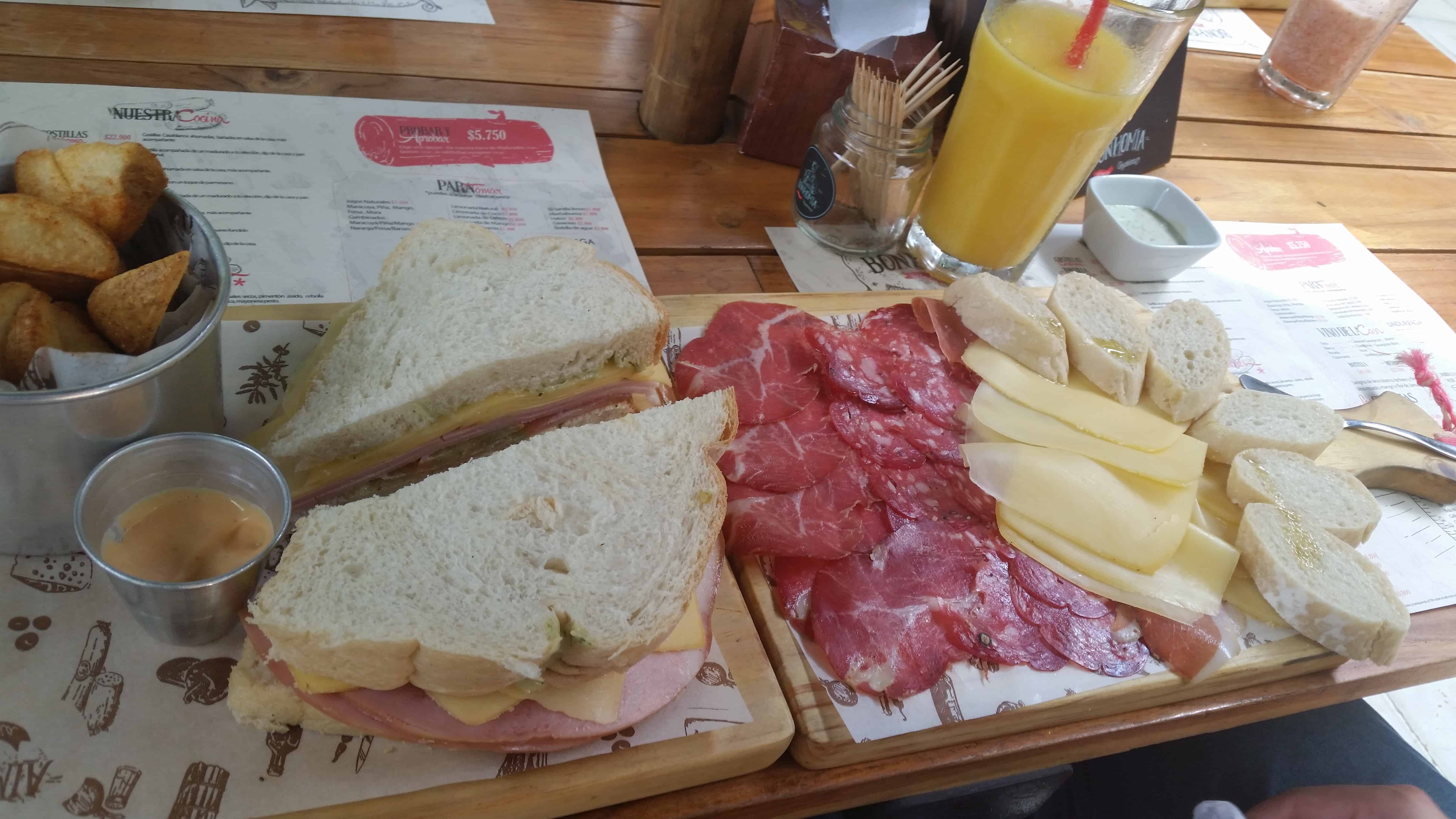 Sandwich, meats, and cheeses at Bonhomía in Provenza, El Poblado, Medellín, Antioquia, Colombia