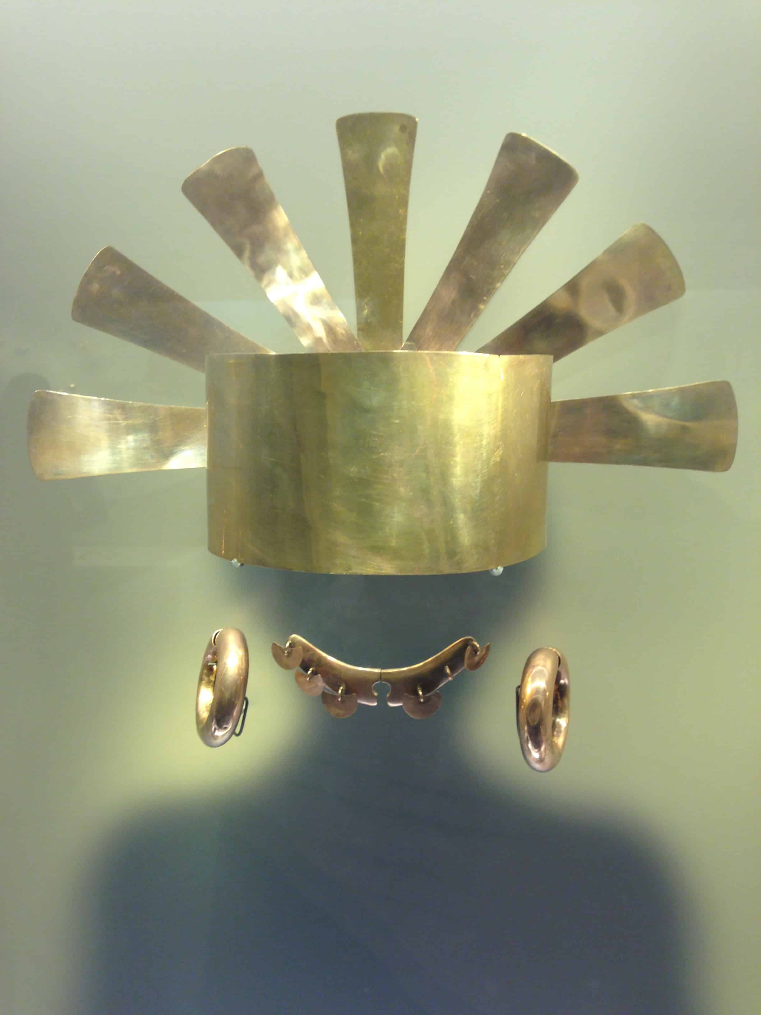 Golden crown, nose, and earrings at the Gold Museum in Bogotá, Colombia