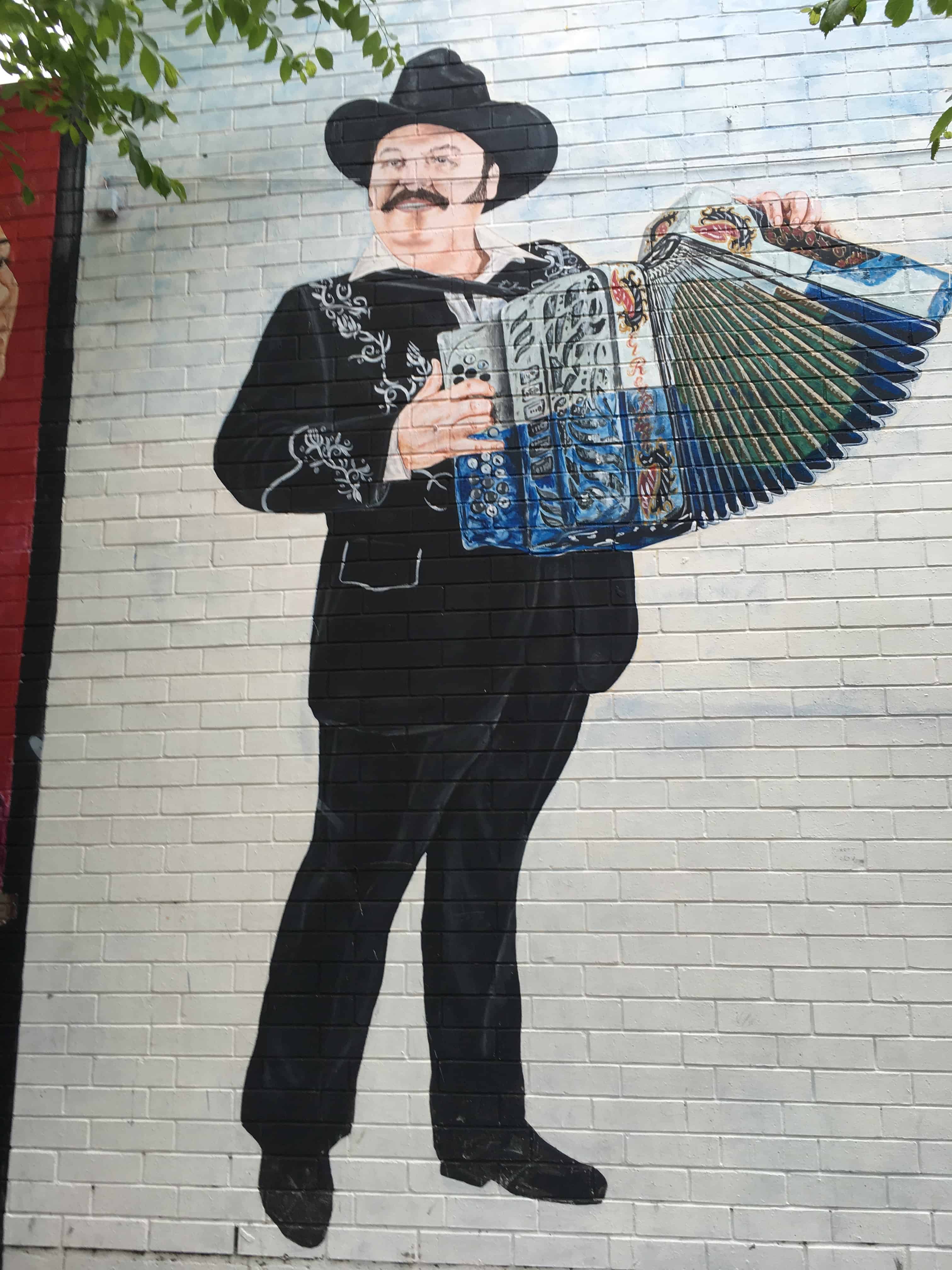 Man playing an accordion at 18th and Wood
