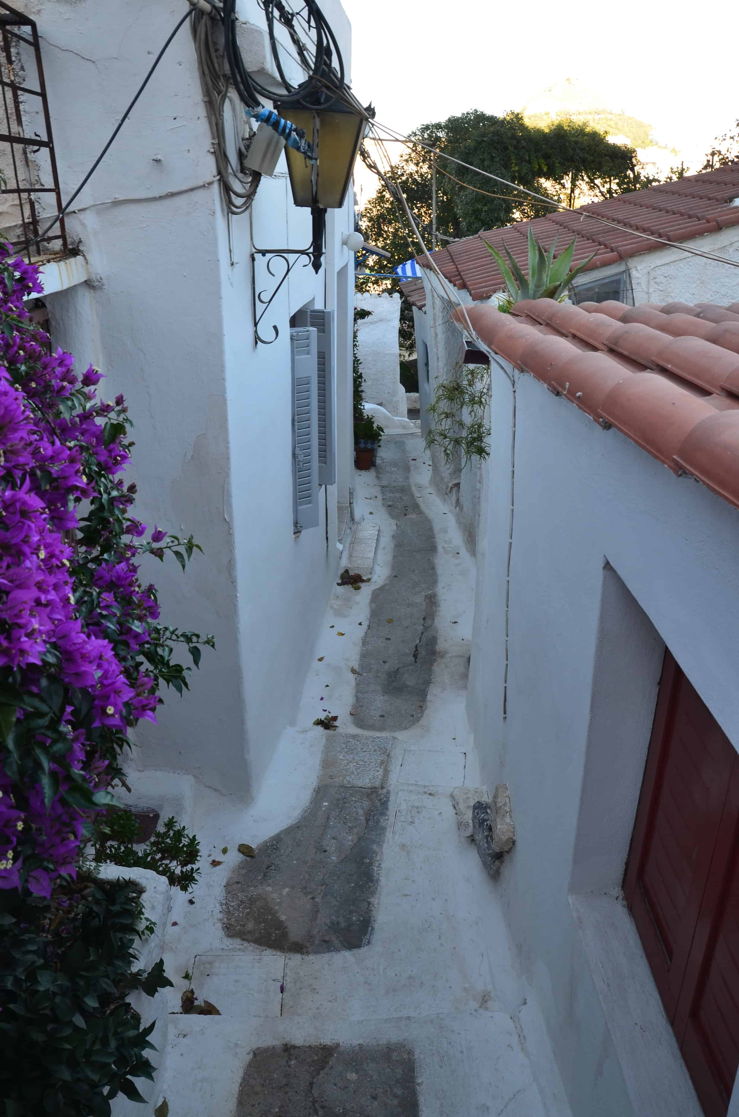 Looking down a narrow alley in Anafiotika, Athens, Greece