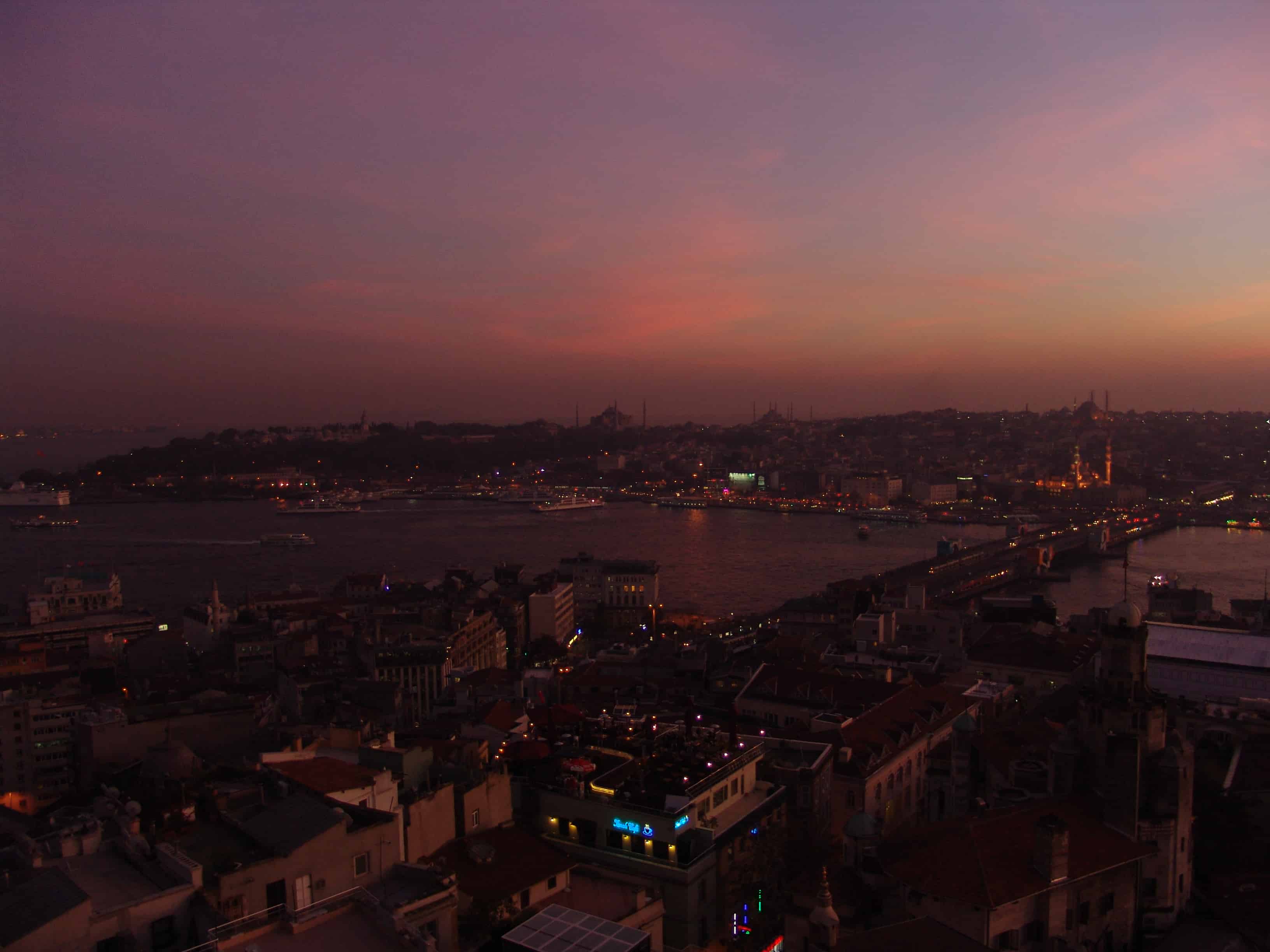 Looking towards the old city at sunset from the top of the Galata Tower in Beyoğlu, Istanbul, Turkey