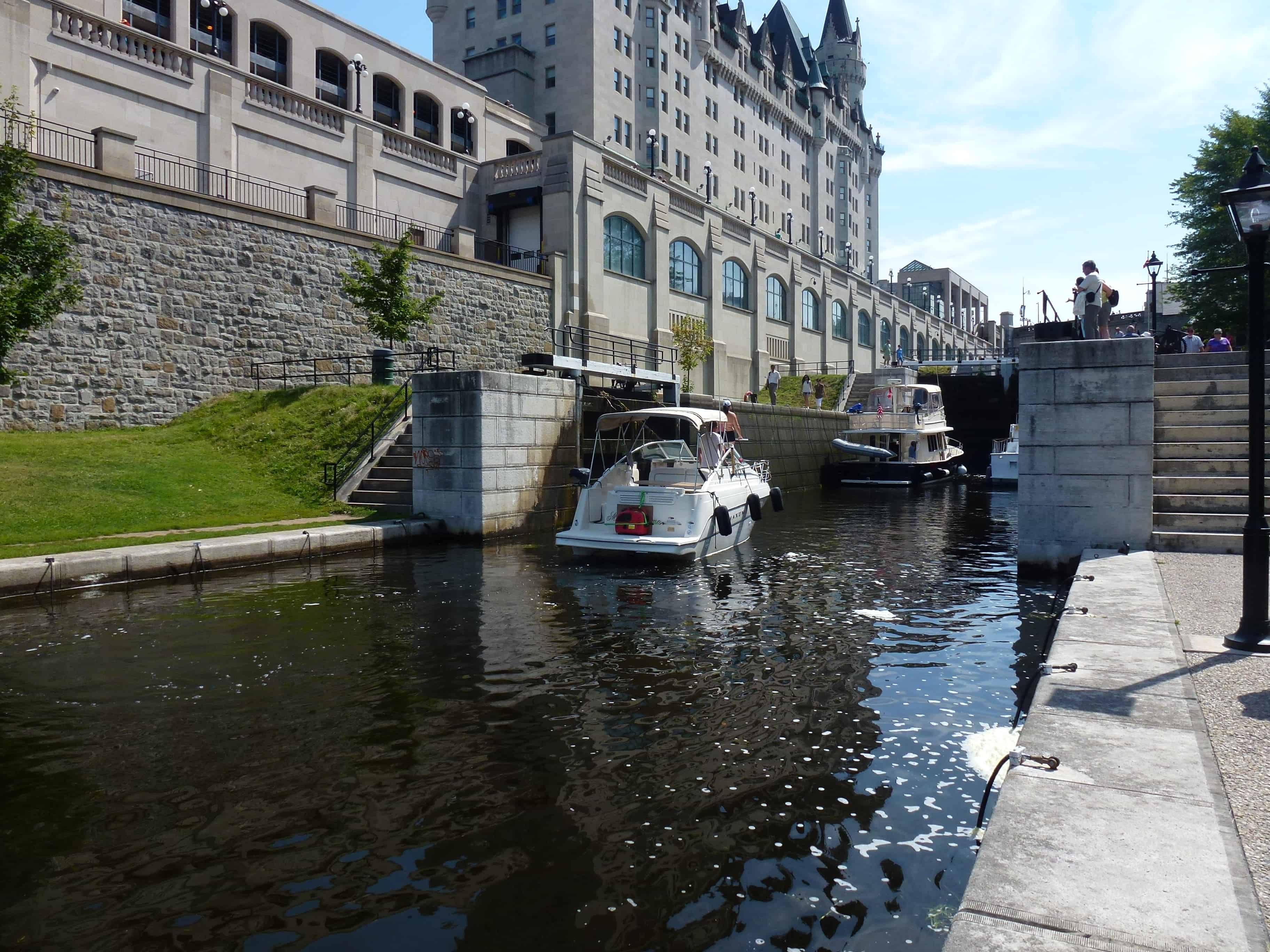 Boats passing through the locks on the Rideau Canal in Ottawa, Ontario, Canada