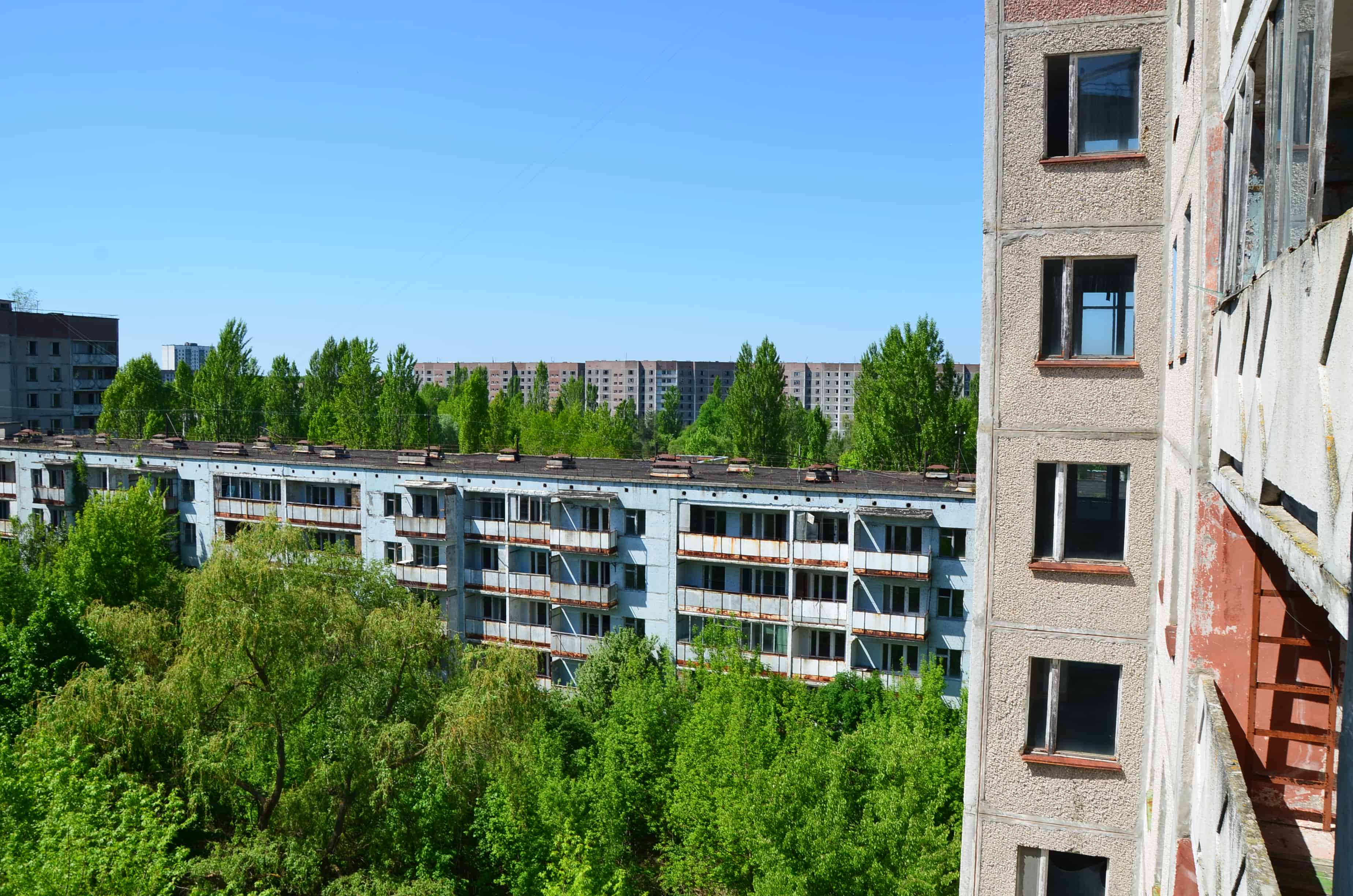 Looking out a window at 17 Sportivnaya Street in Pripyat, Chernobyl Exclusion Zone, Ukraine