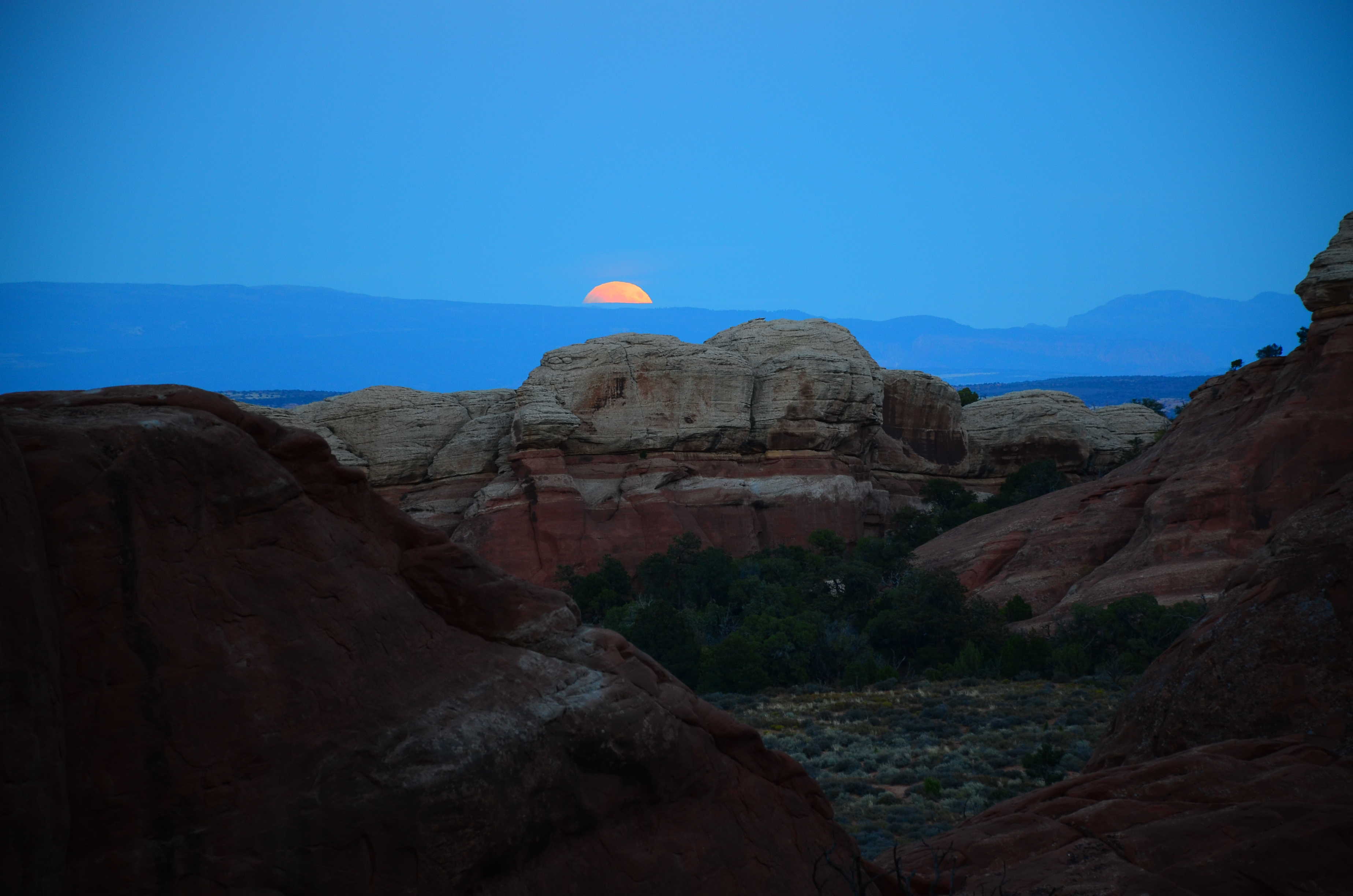 Blood moon on the Devil's Garden Trail at Arches National Park in Utah
