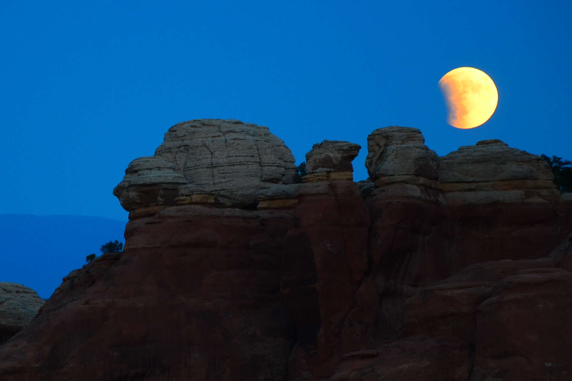 Blood moon on the Devil's Garden Trail at Arches National Park in Utah