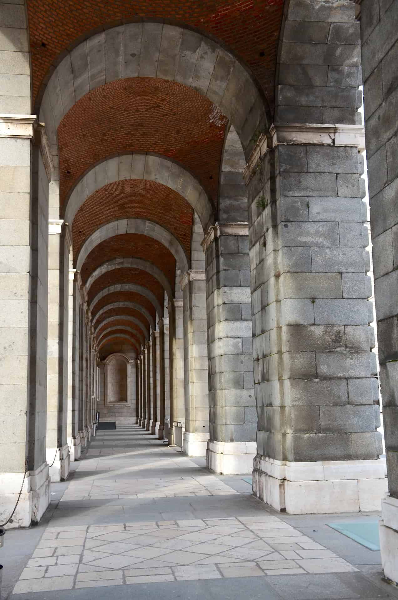 Arched colonnade at the Royal Palace in Madrid, Spain