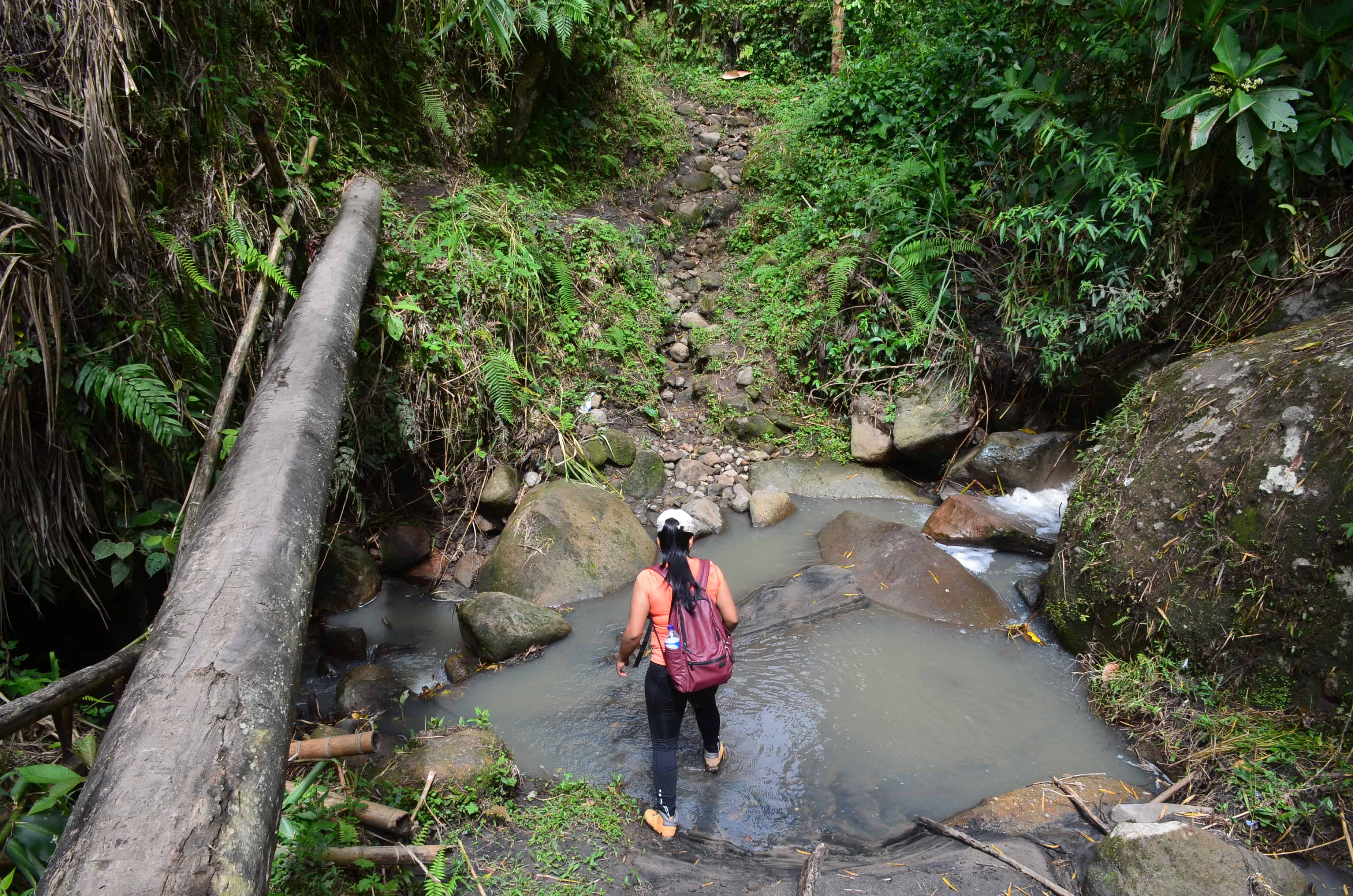 Crossing a creek at Tierradentro, Cauca, Colombia