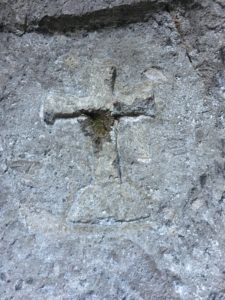 A cross carved on top of the entrance to a tunnel at Pirámide near Inzá, Cauca, Colombia