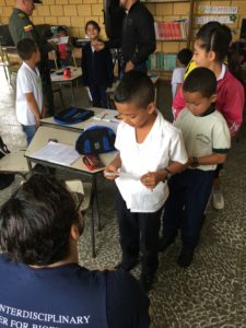 A student reading his speech to Ahmad in Belén de Umbría, Risaralda, Colombia