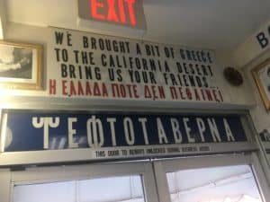 Above the exit at the Mad Greek Café in Baker, California
