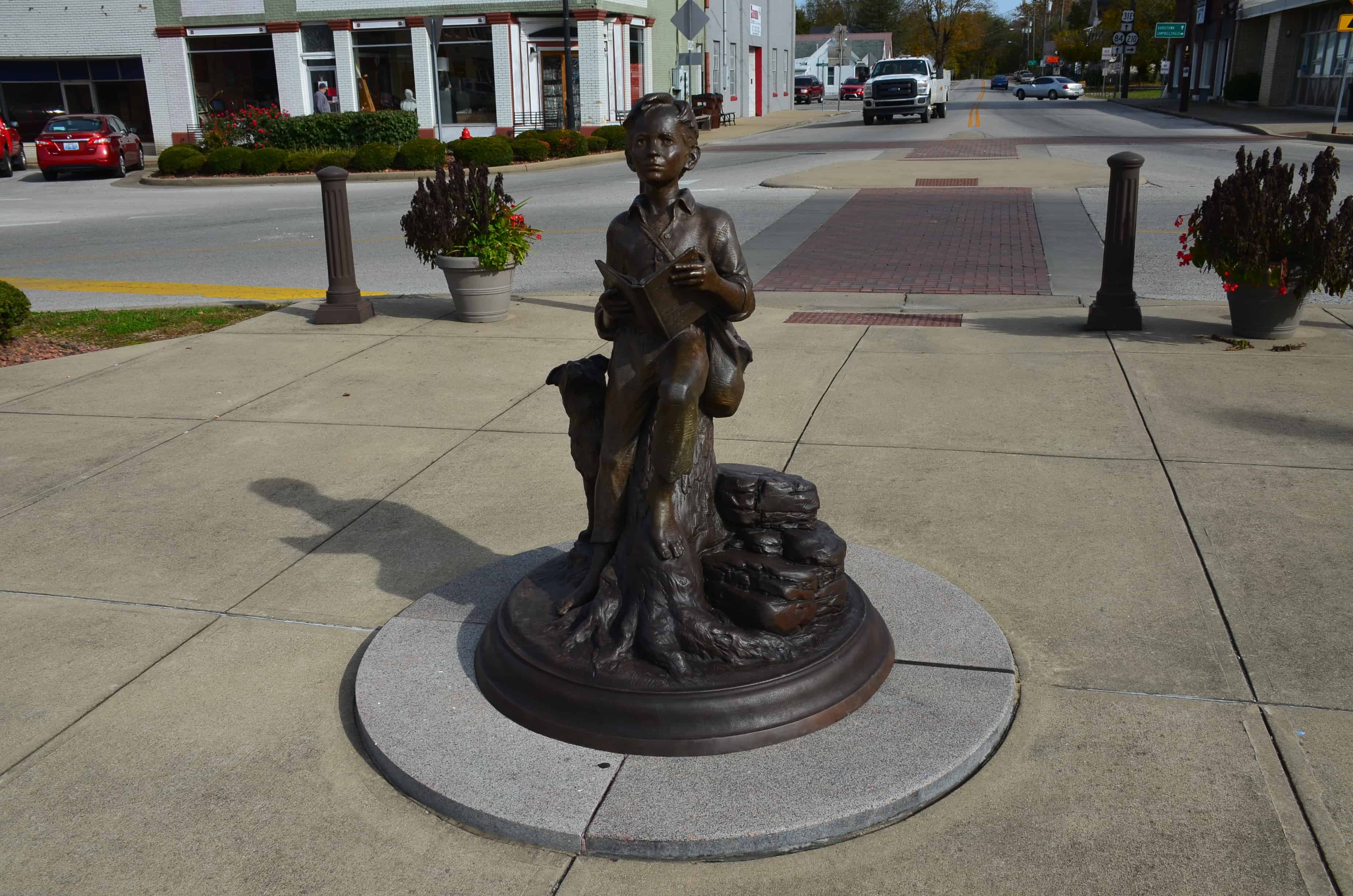 Statue of young Abe Lincoln at Lincoln Square Circle in Hodgenville, Kentucky