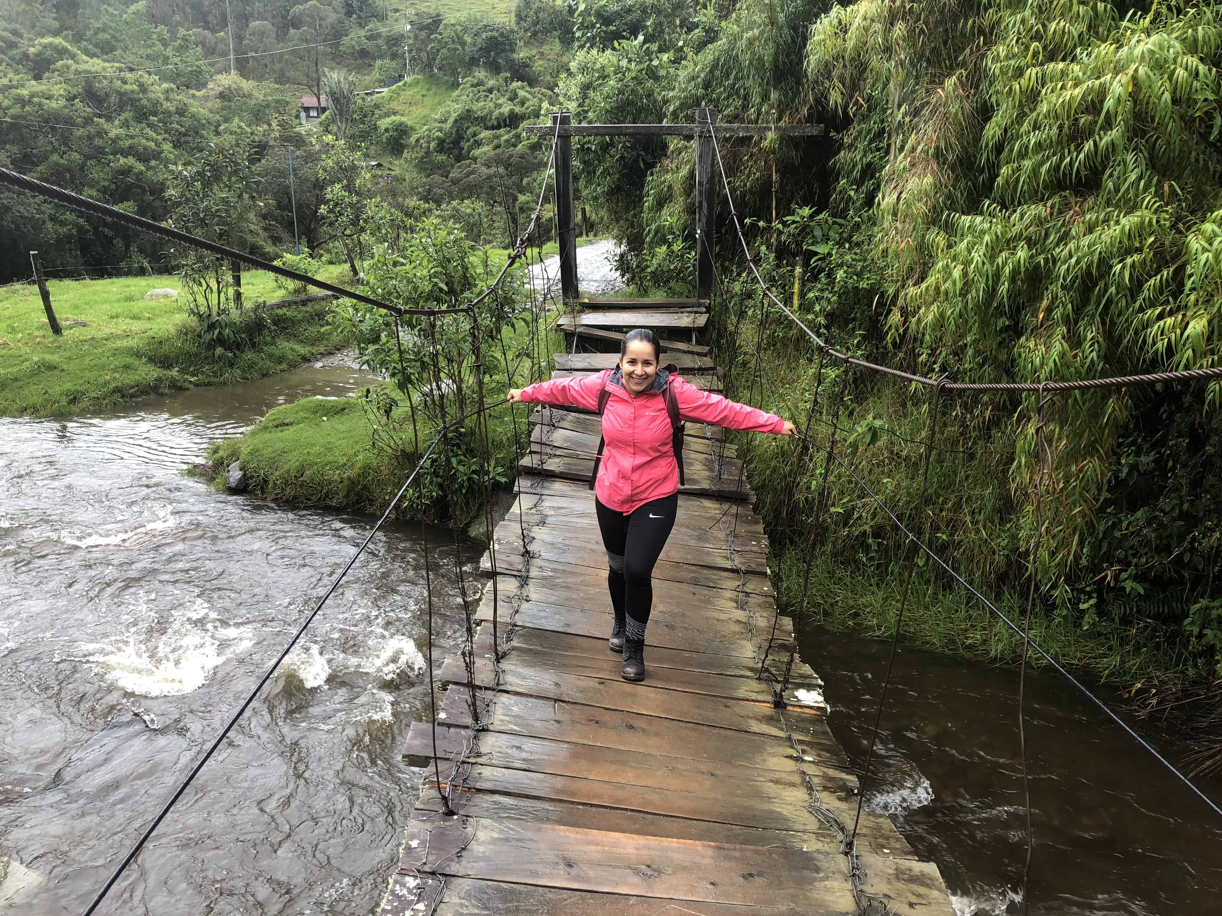 Marisol crossing the first suspension bridge at Cocora Valley in Quindío, Colombia