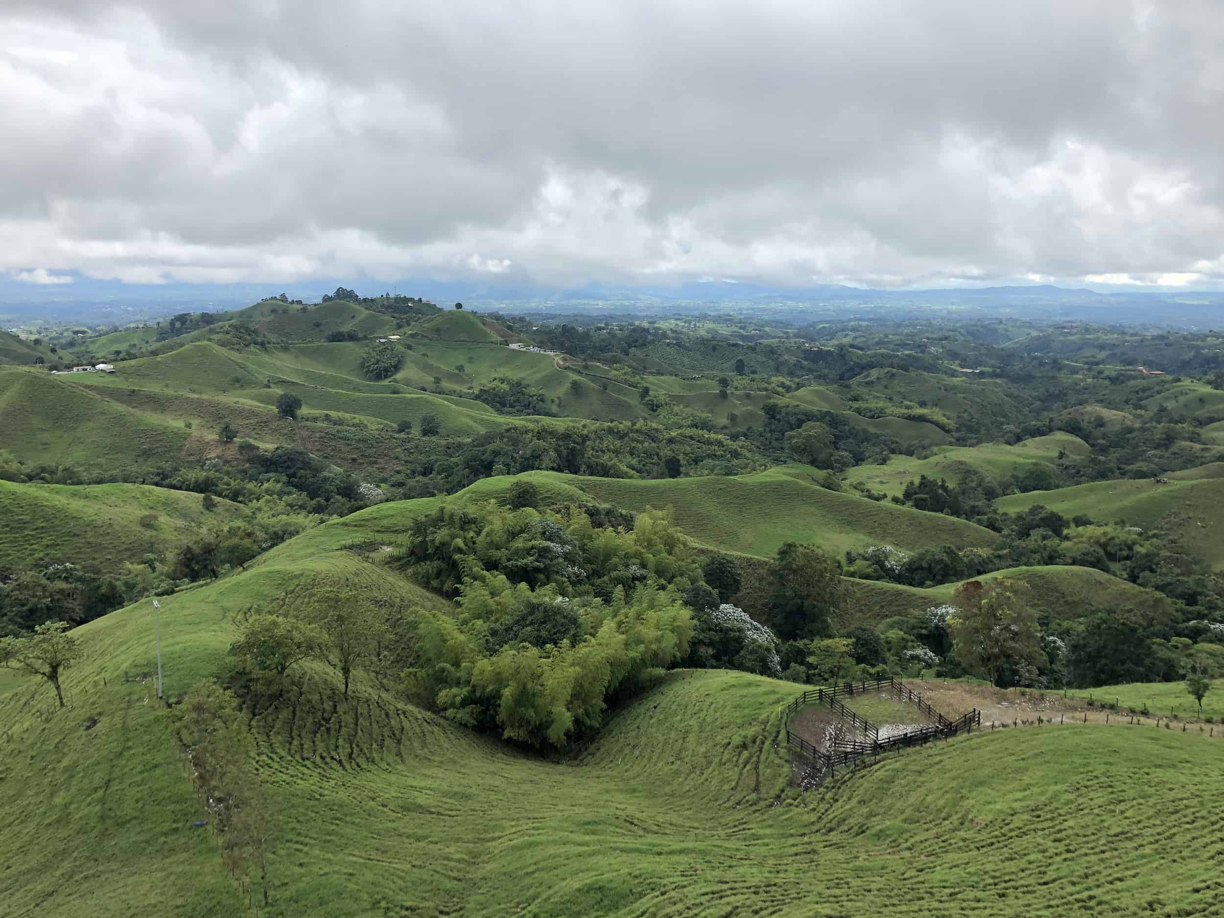 Looking at the rolling green hills from the Mirador Colina Iluminada in Filandia, Quindío, Colombia