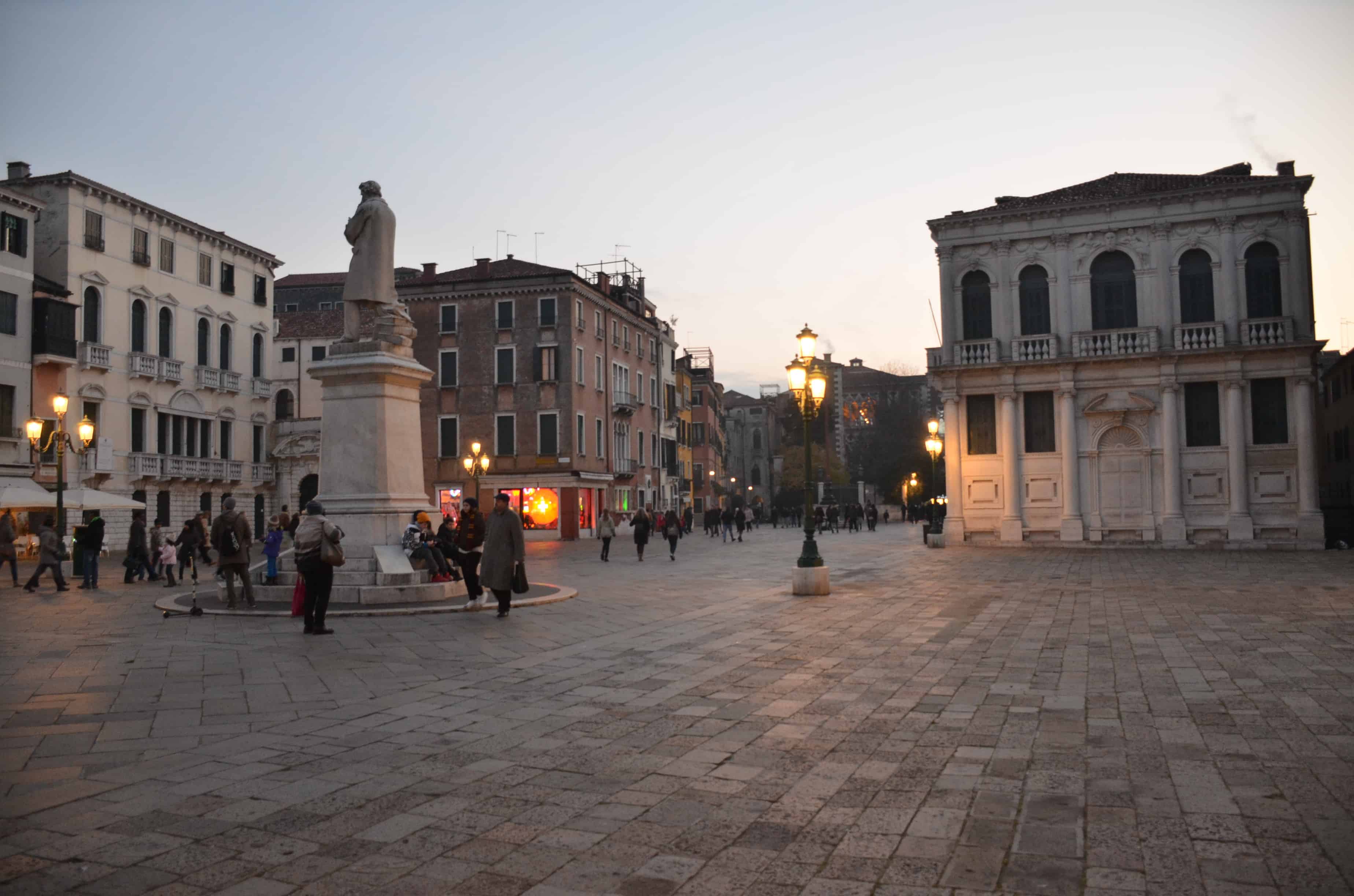 Statue of Niccolò Tommaseo (left) in Campo Santo Stefano in Venice, Italy