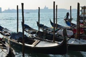 Gondolas lined up in front of Riva degli Schiavoni in Venice, Italy