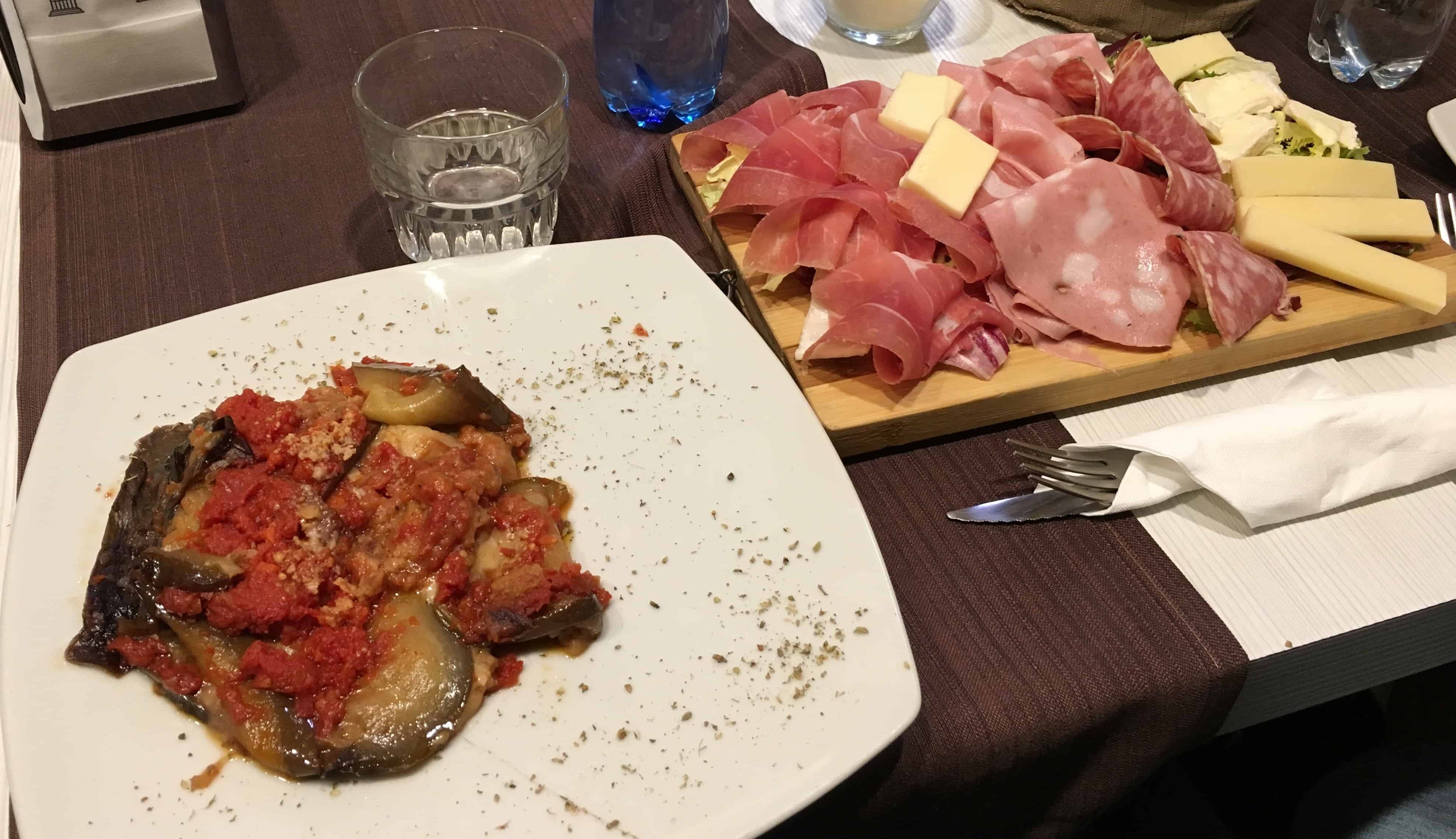 Eggplant parmigiana and meat and cheese board at Accademia Caffè