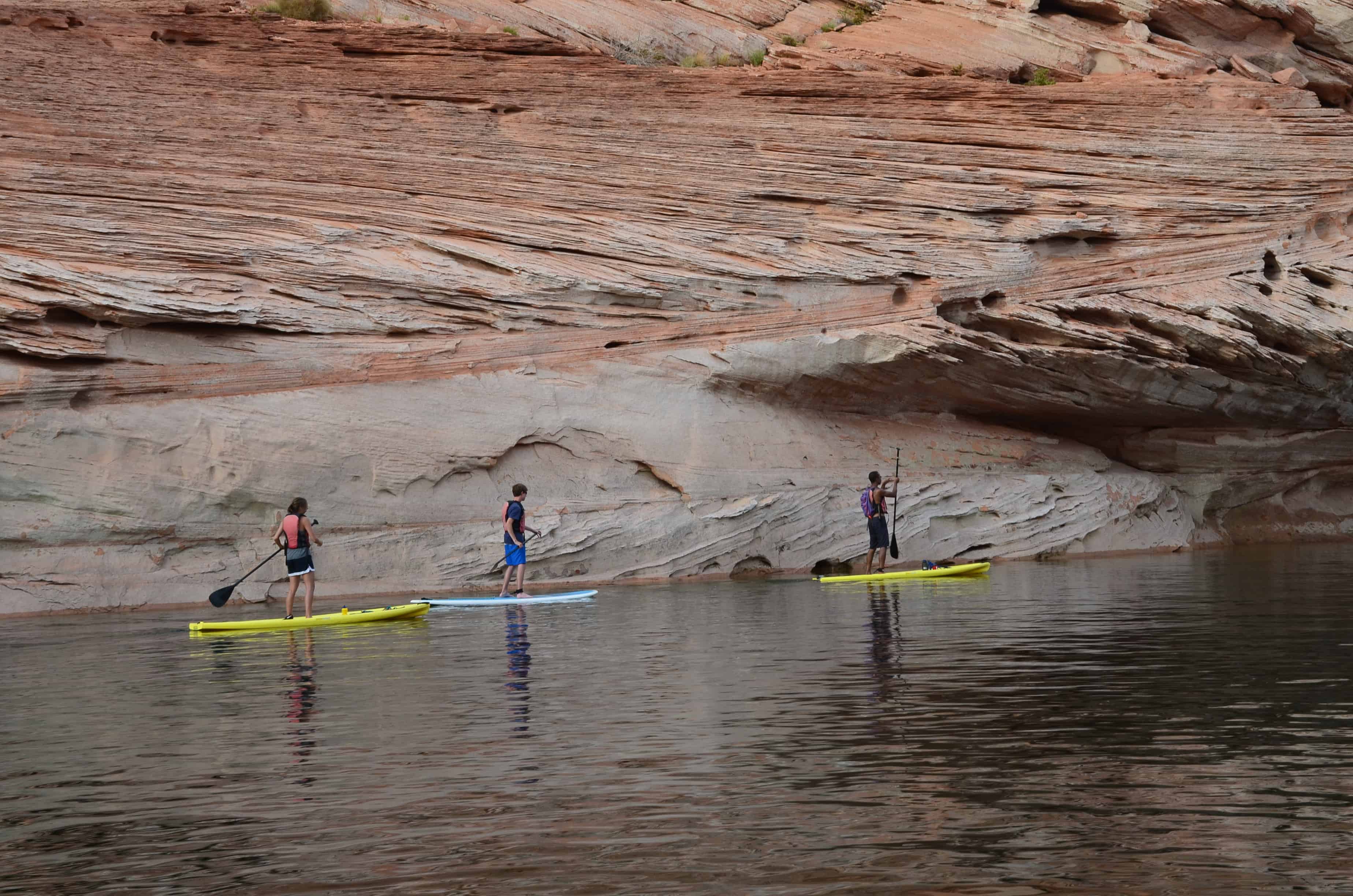Stand-up paddlers on Lake Powell at Glen Canyon National Recreation Area in Arizona