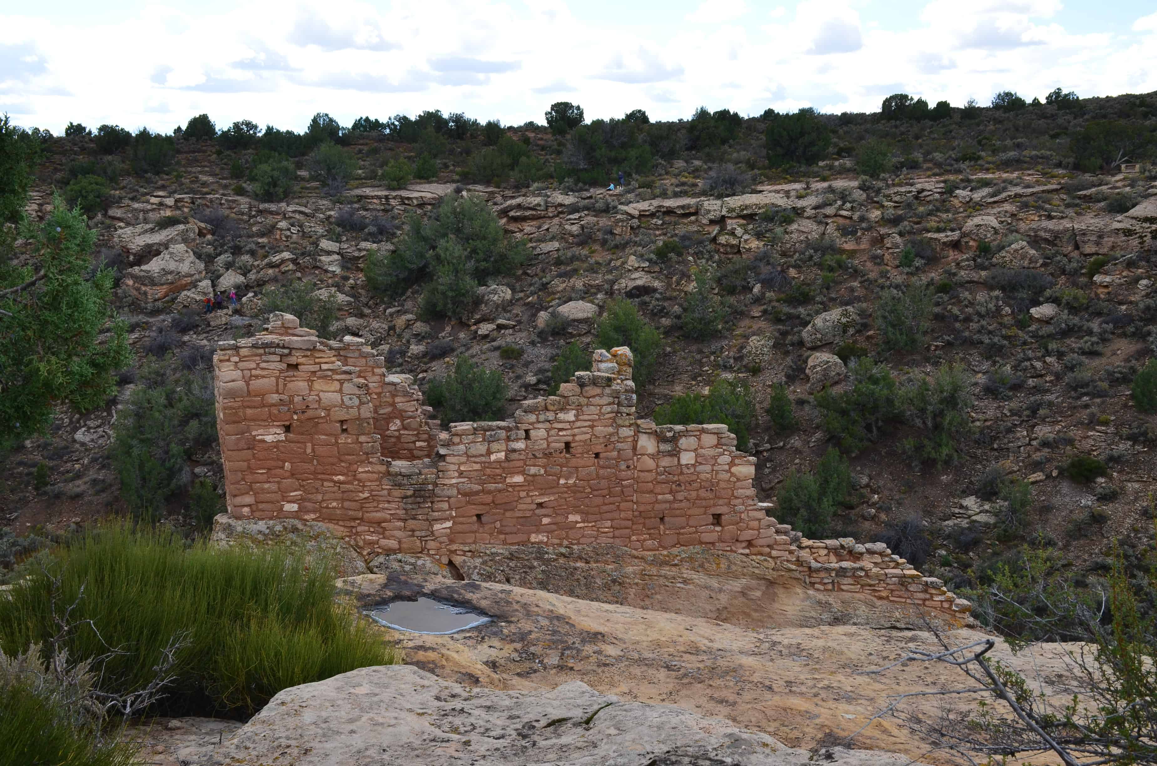 Walking past Stronghold House at Hovenweep National Monument in Utah
