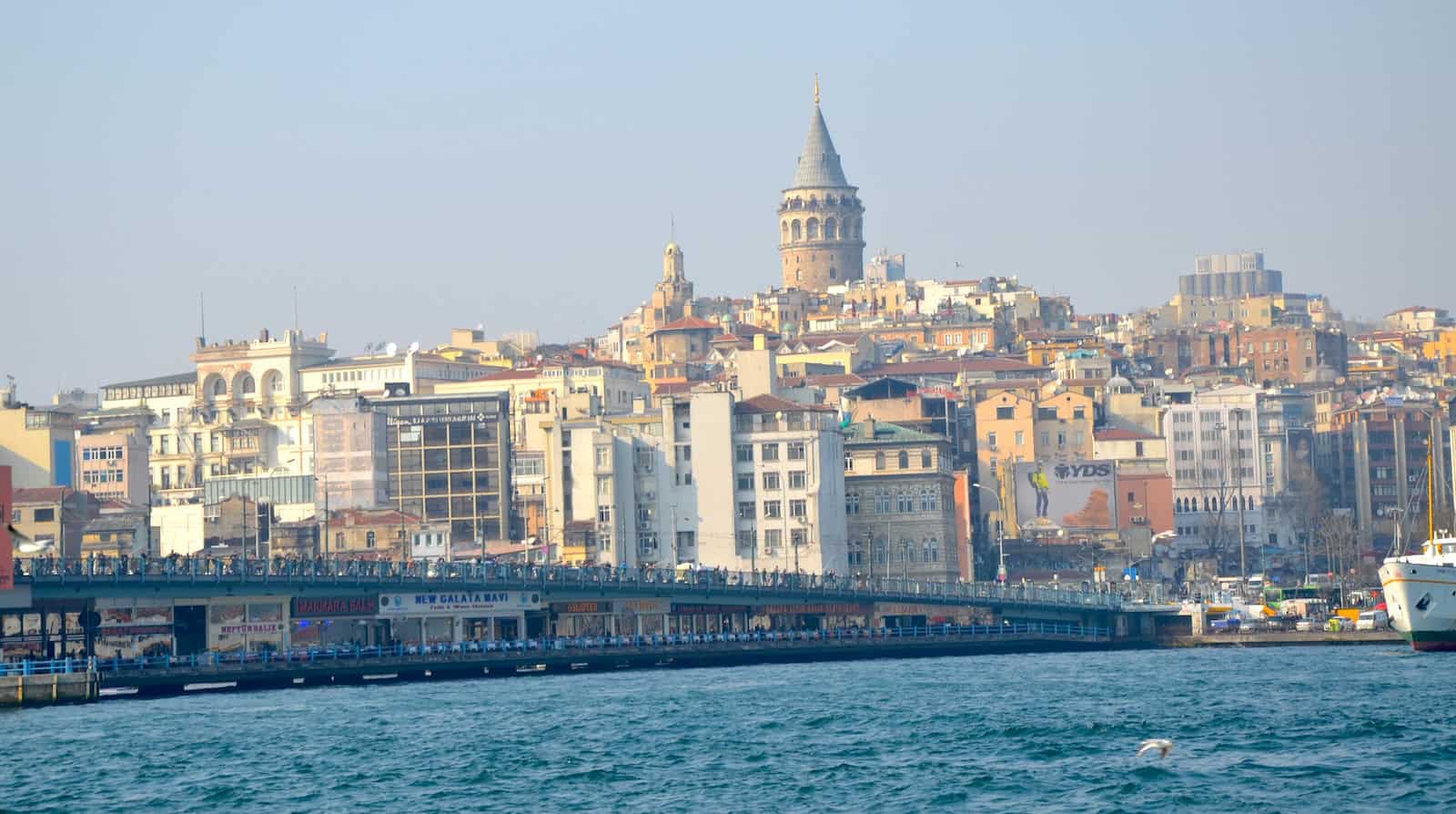 The Galata Tower rising above Karaköy from Eminönü in Istanbul, Turkey