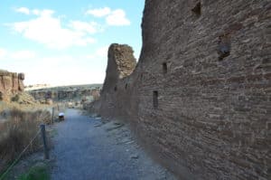 Walking along the outer wall at Hungo Pavi at Chaco Culture National Historical Park in New Mexico