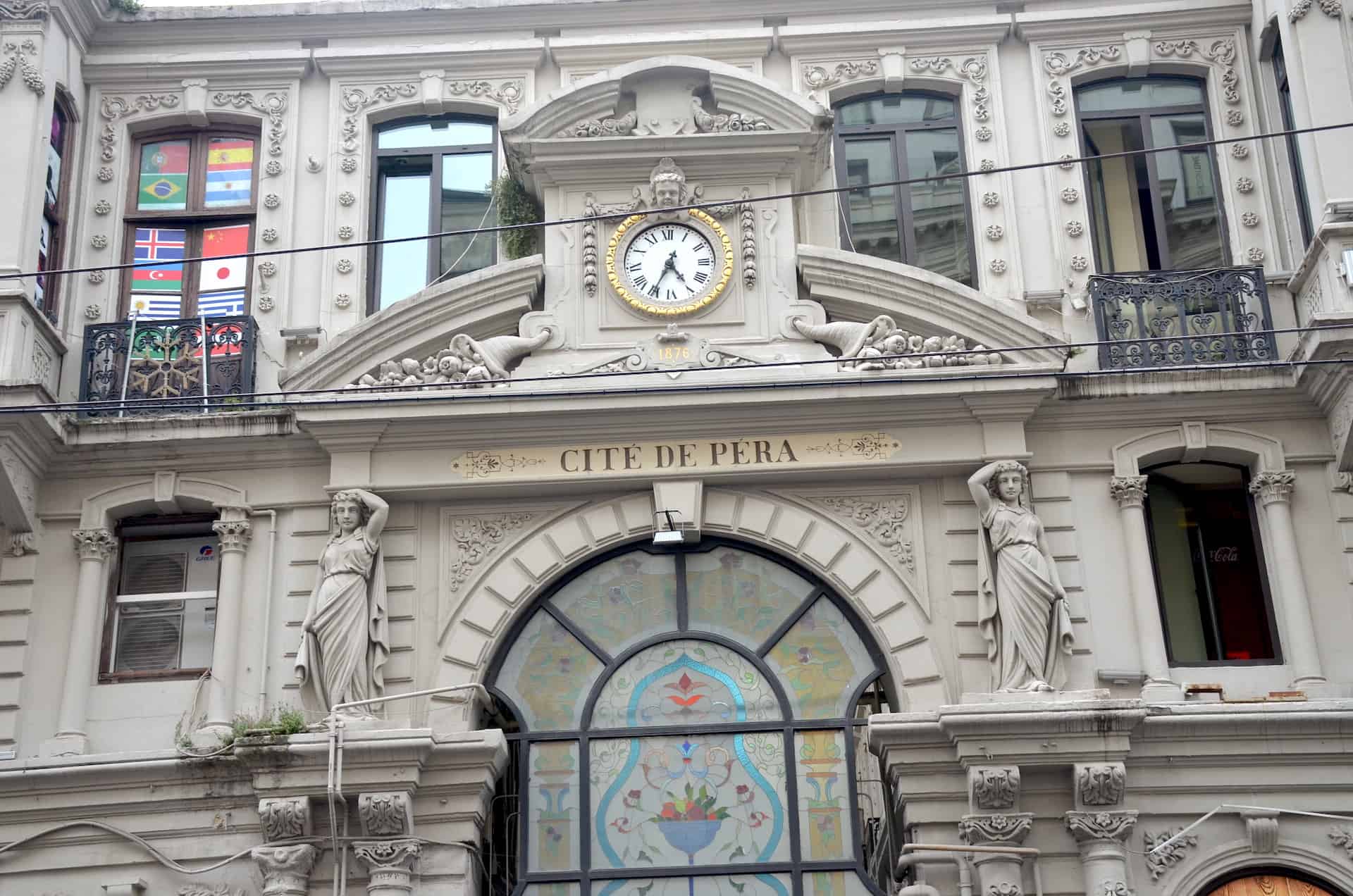Clock and ornamental stonework above the entrance to Flower Passage in Istanbul, Turkey