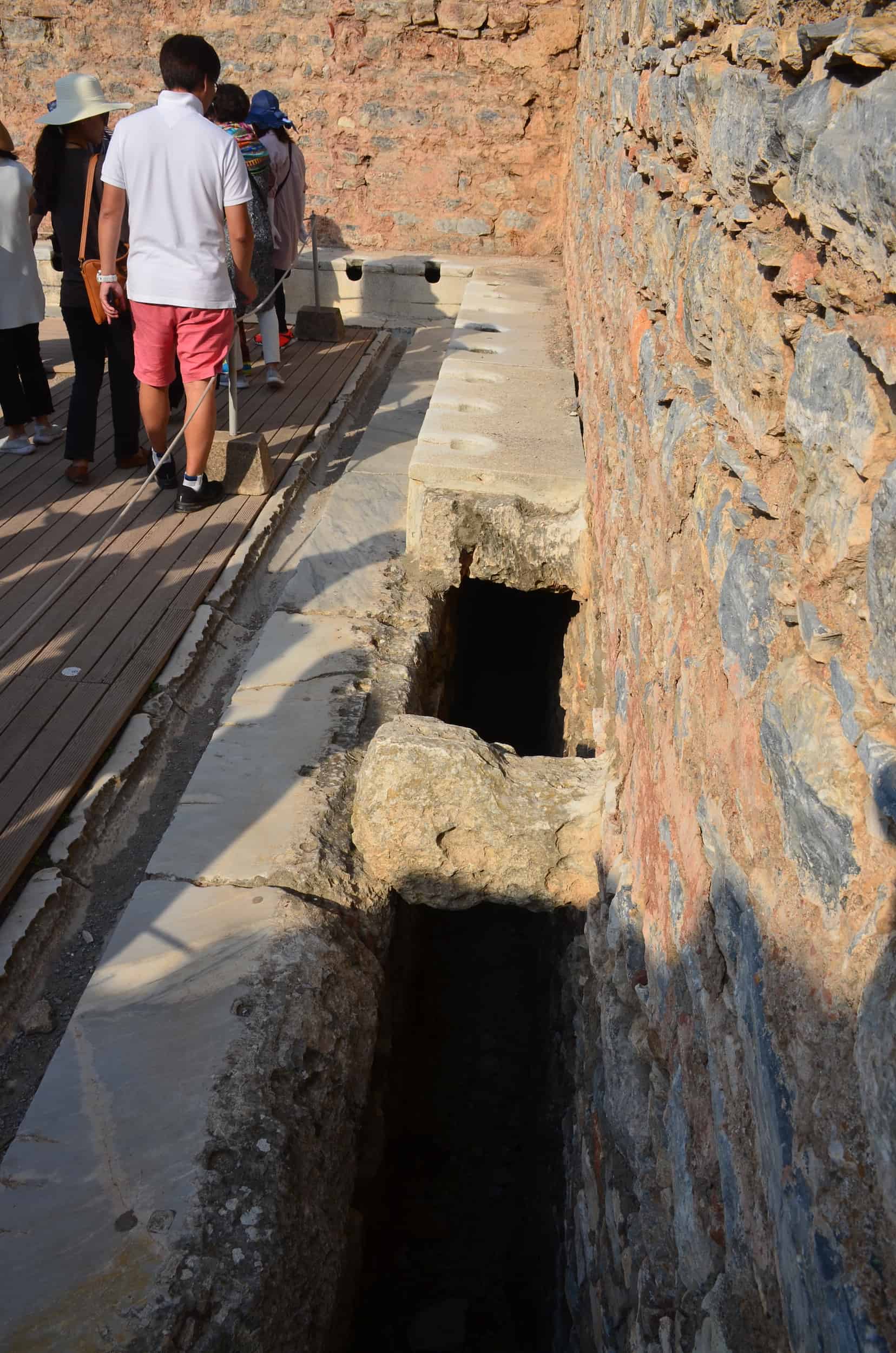 Broken section of toilets at the latrines in Ephesus