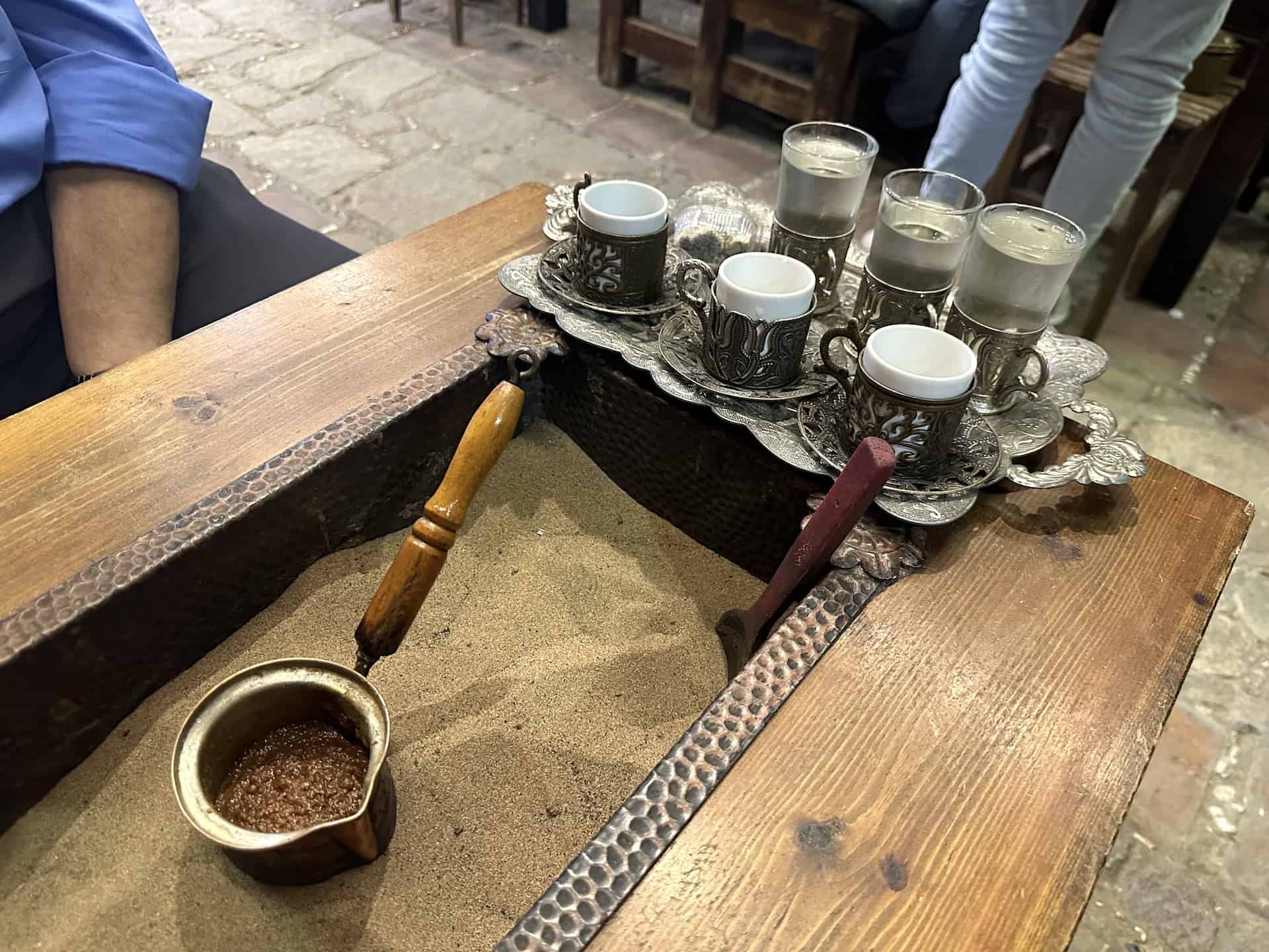 Turkish coffee cooked in hot sand at Fındık Café in Şirince, Turkey