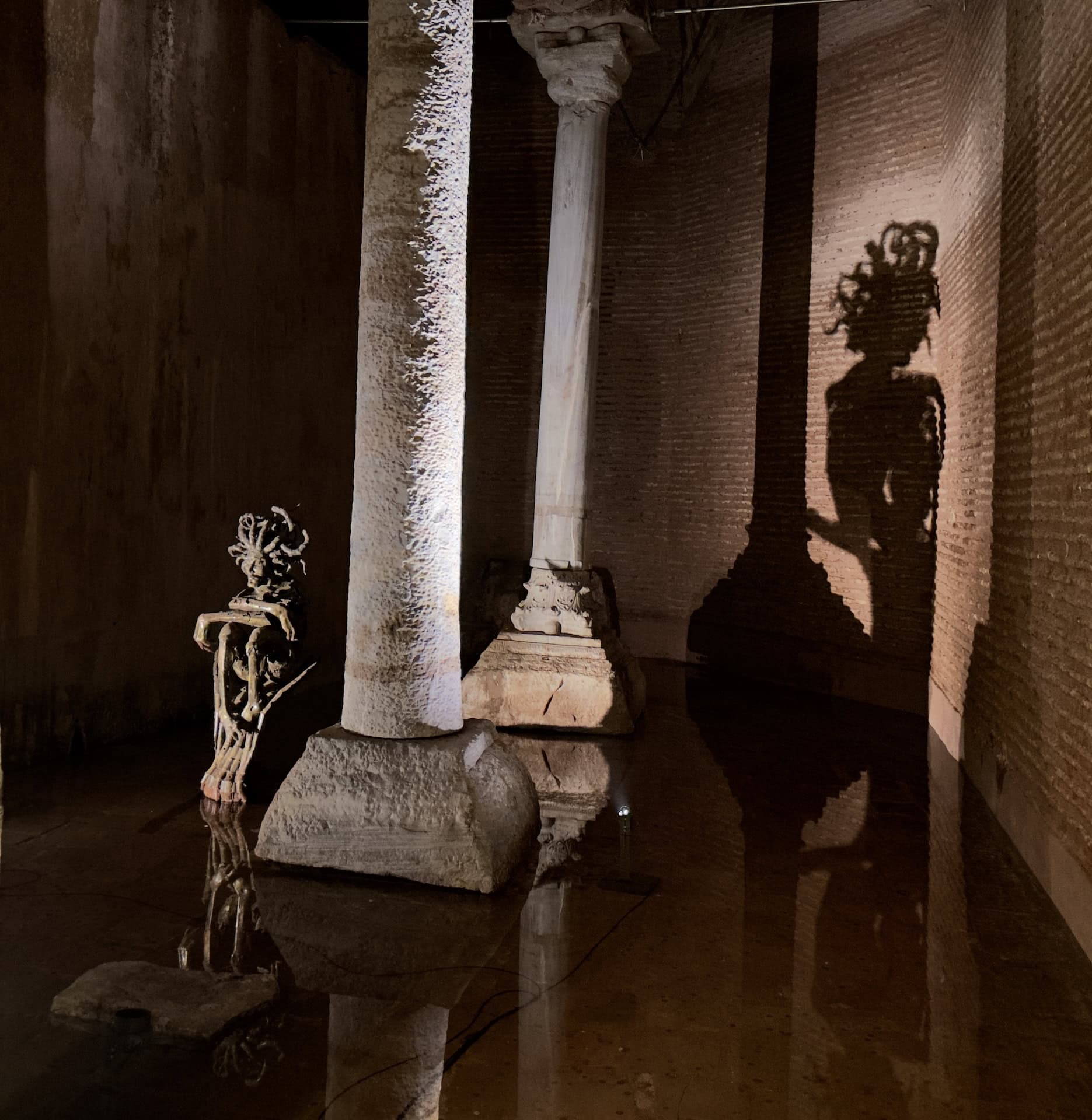 Medusa sculpture with shadow in the Basilica Cistern in Istanbul, Turkey